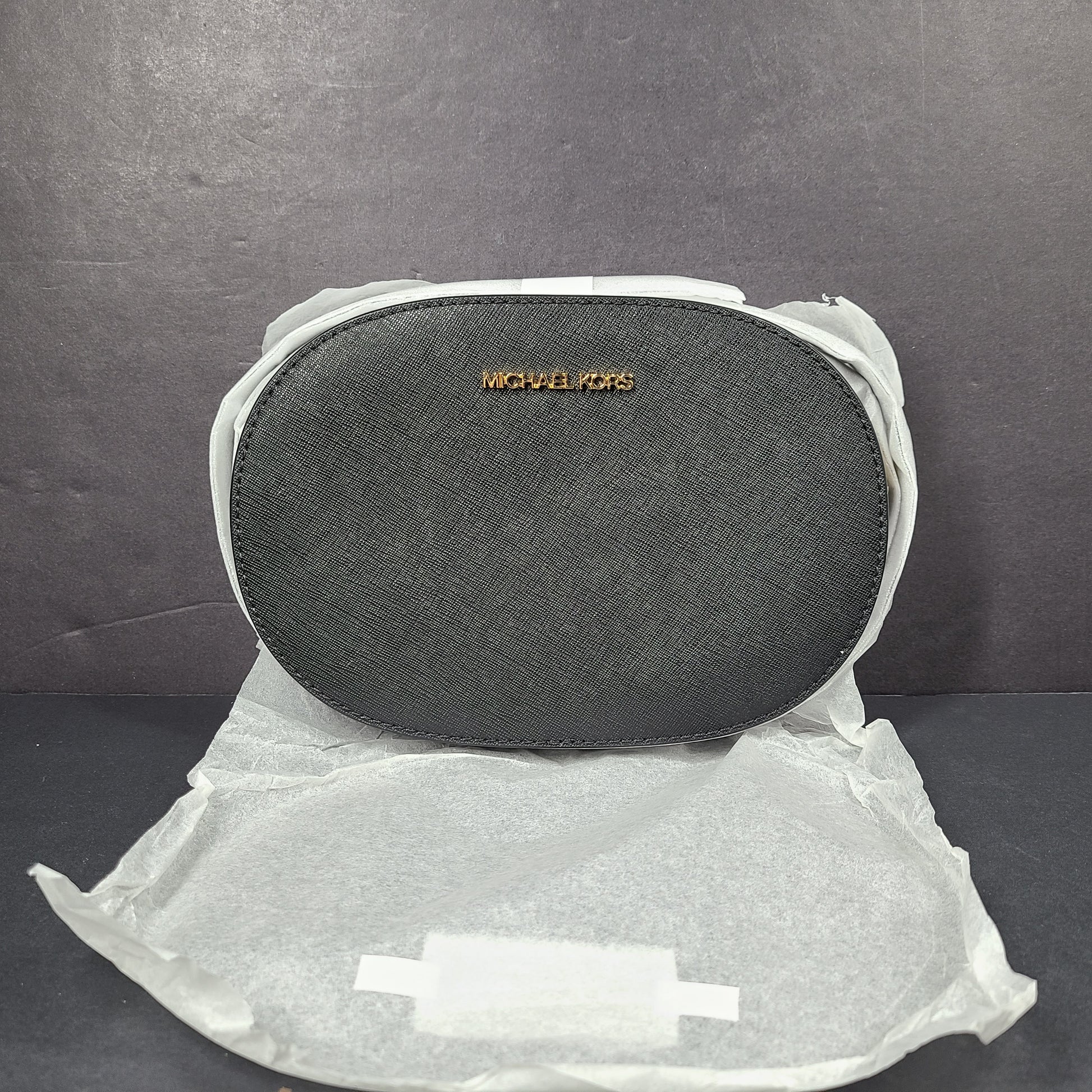 Sleek black Michael Kors crossbody with a signature front logo and a streamlined silhouette for everyday wear.