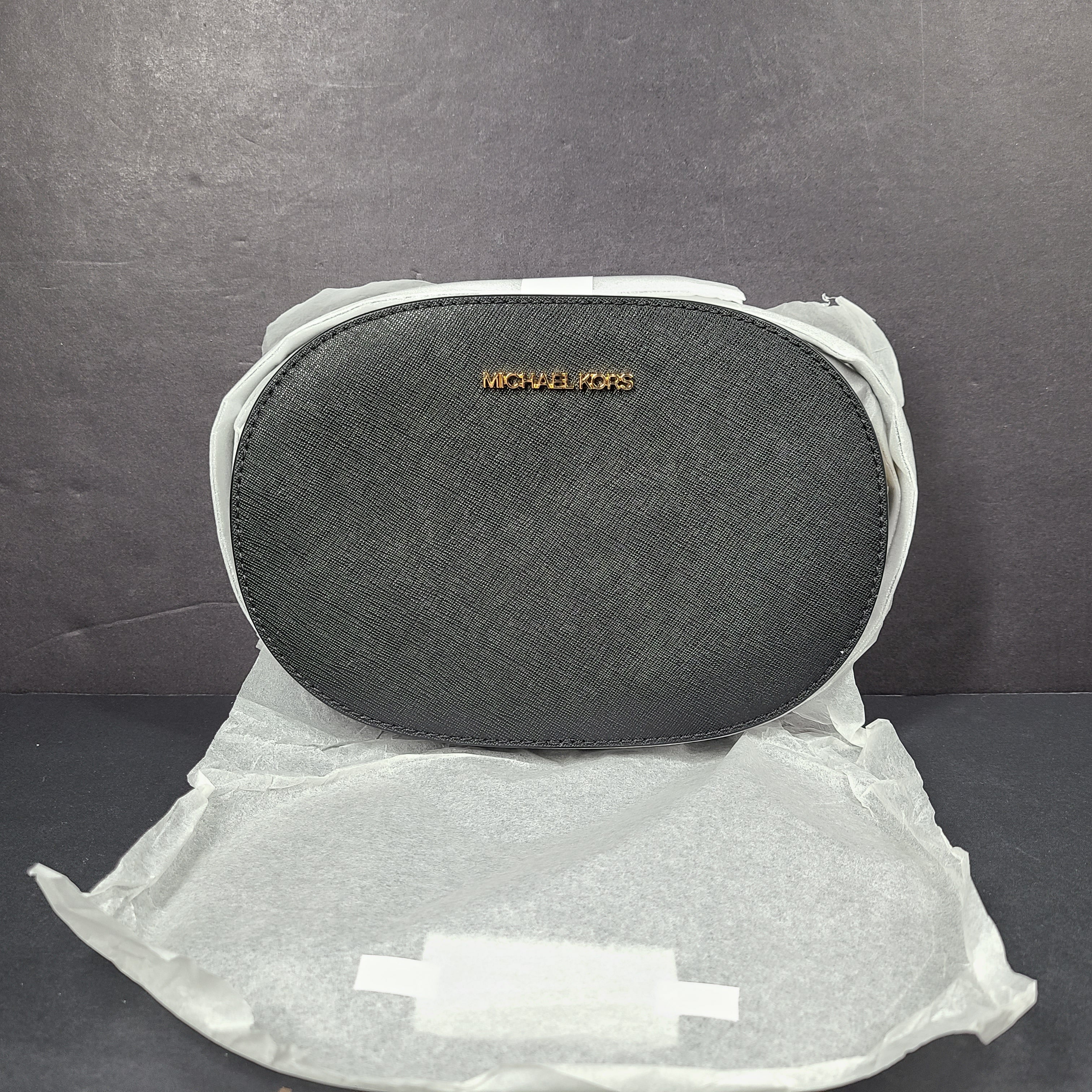 Sleek black Michael Kors crossbody with a signature front logo and a streamlined silhouette for everyday wear.