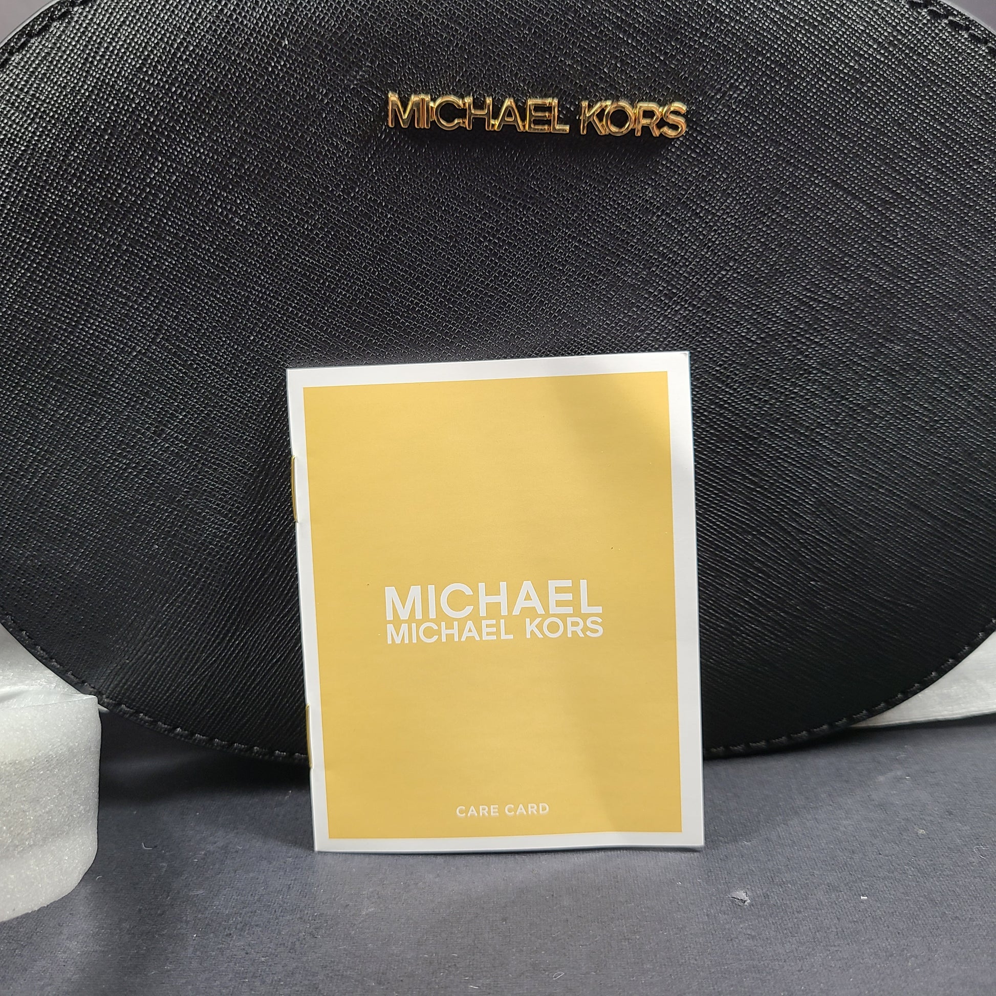 Sleek black Michael Kors crossbody with a signature front logo and a streamlined silhouette for everyday wear.