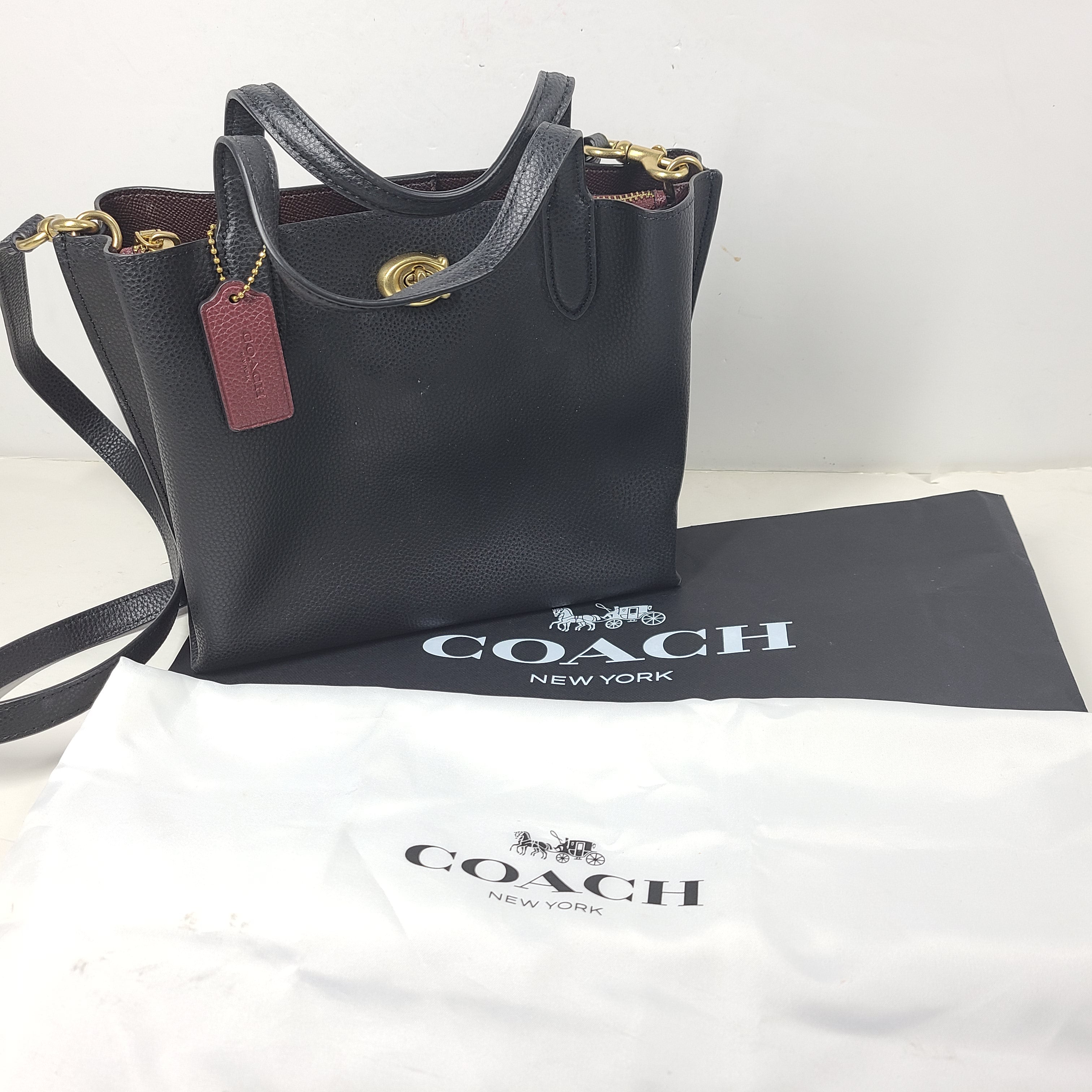 Black Coach G2222-C8869 handbag with a streamlined silhouette and top handles for everyday wear.