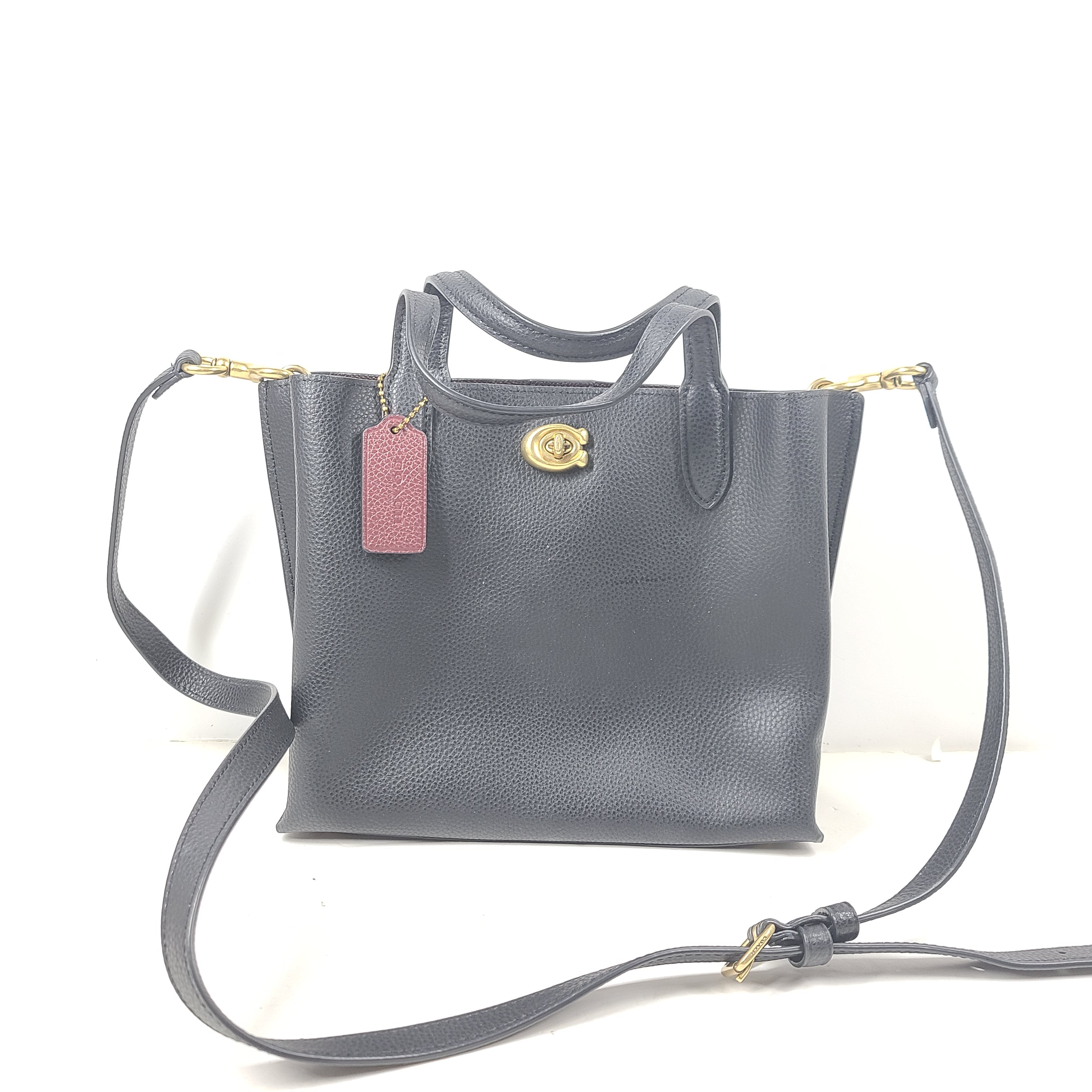 Black Coach G2222-C8869 handbag with a streamlined silhouette and top handles for everyday wear.