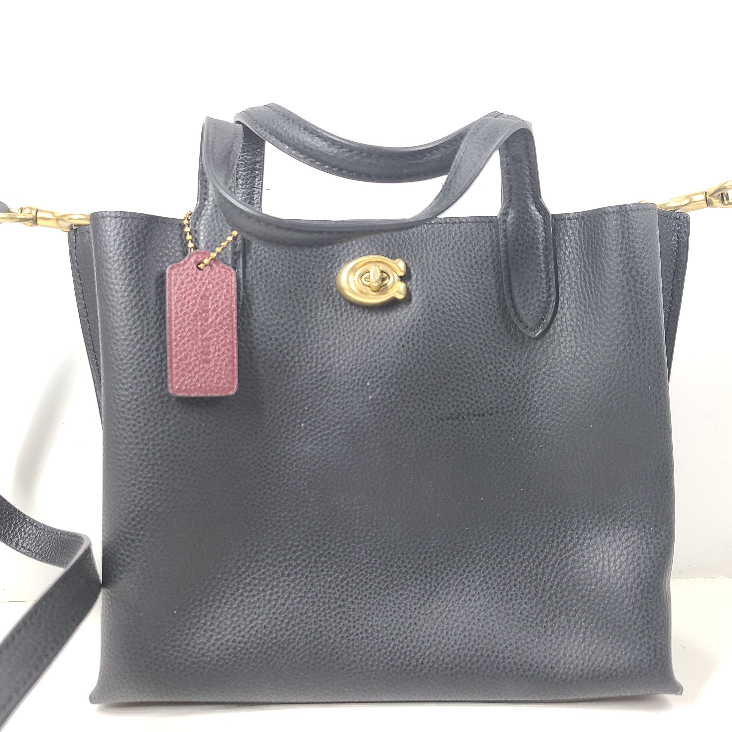 Black Coach G2222-C8869 handbag with a streamlined silhouette and top handles for everyday wear.