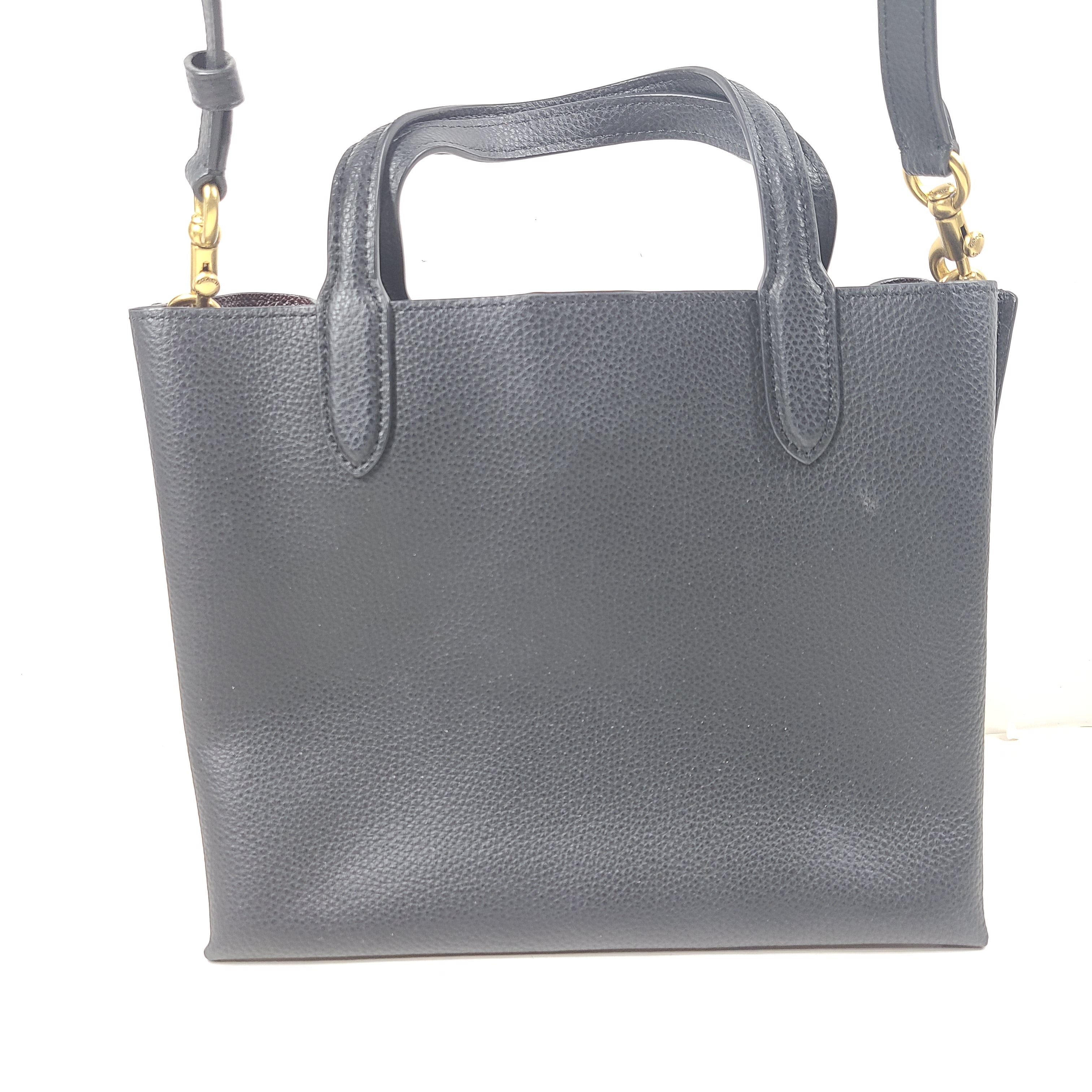 Black Coach G2222-C8869 handbag with a streamlined silhouette and top handles for everyday wear.