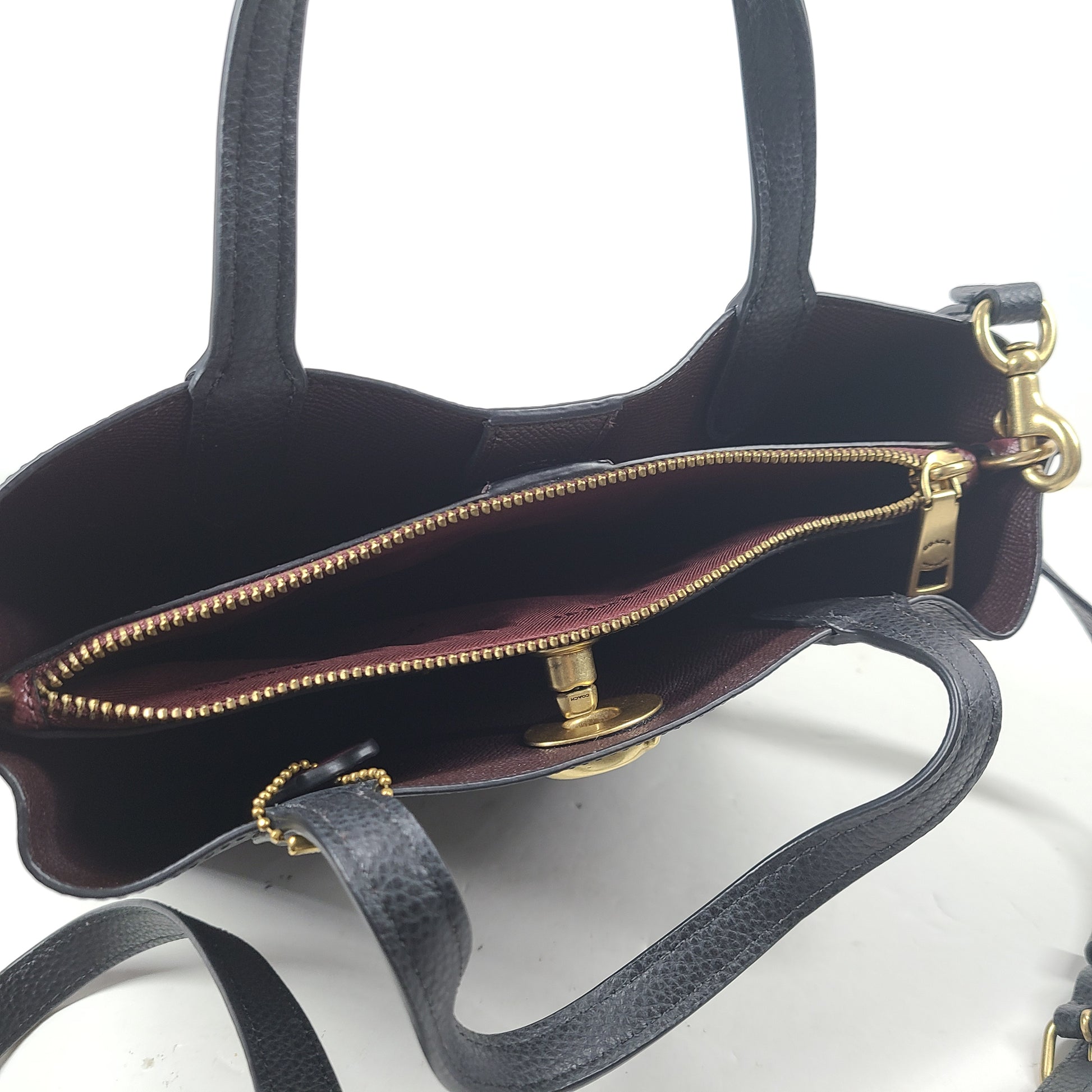 Black Coach G2222-C8869 handbag with a streamlined silhouette and top handles for everyday wear.