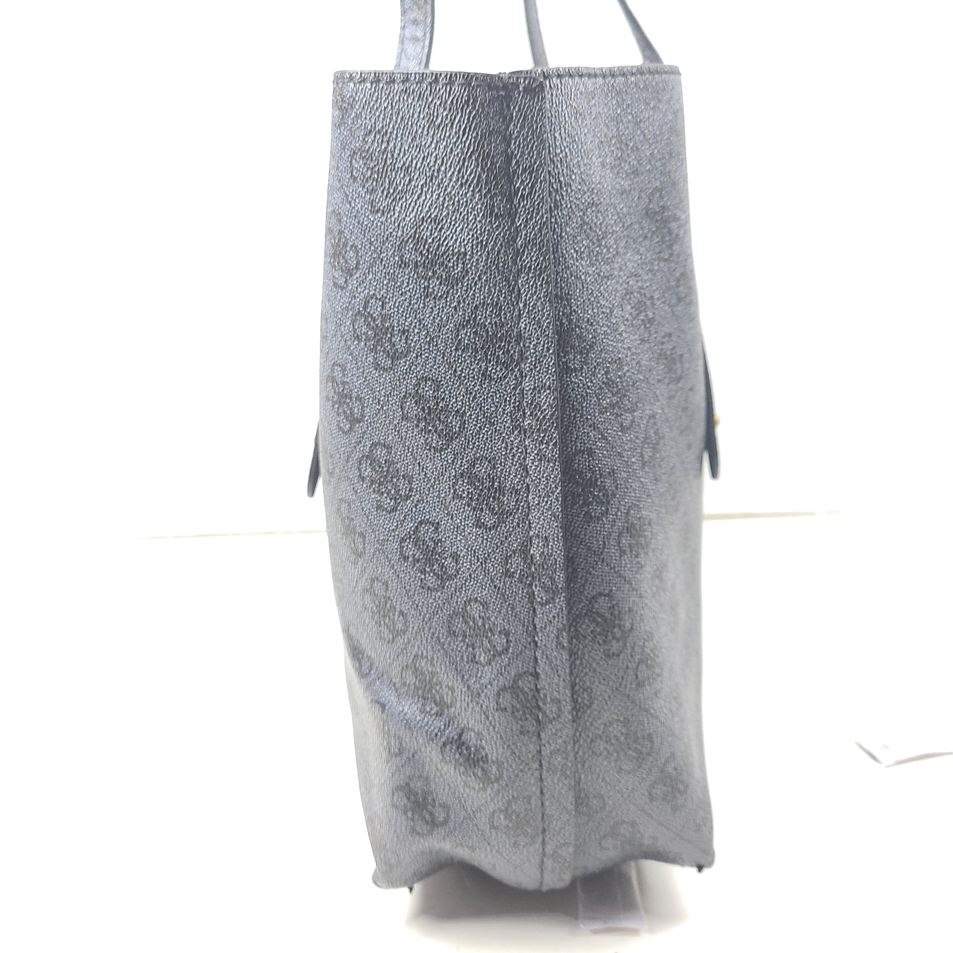 Grey GUESS monogram tote with gold-tone hardware and a matching pouch for organized everyday carry.