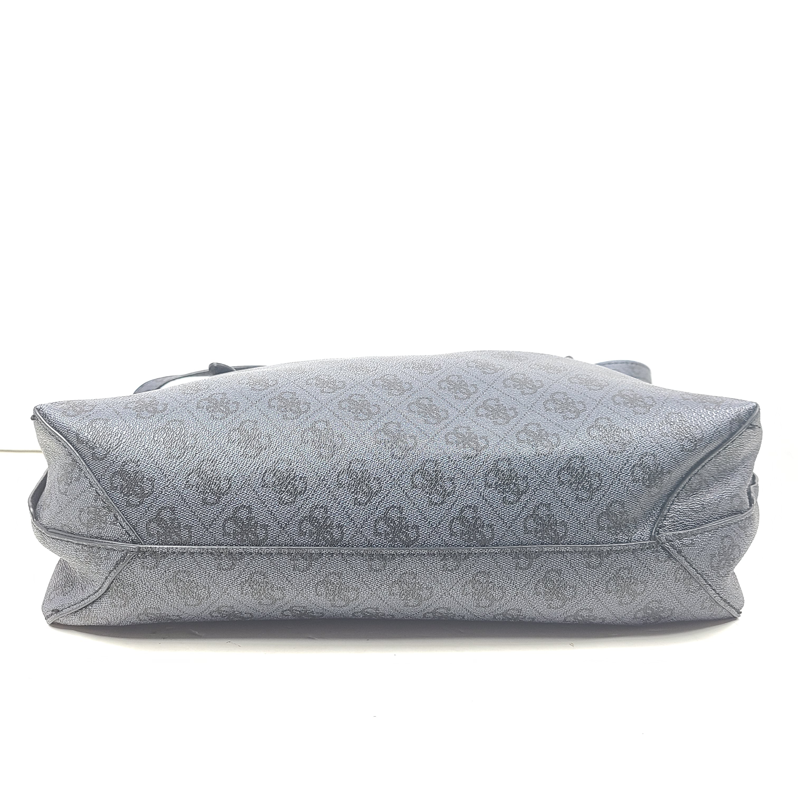Grey GUESS monogram tote with gold-tone hardware and a matching pouch for organized everyday carry.
