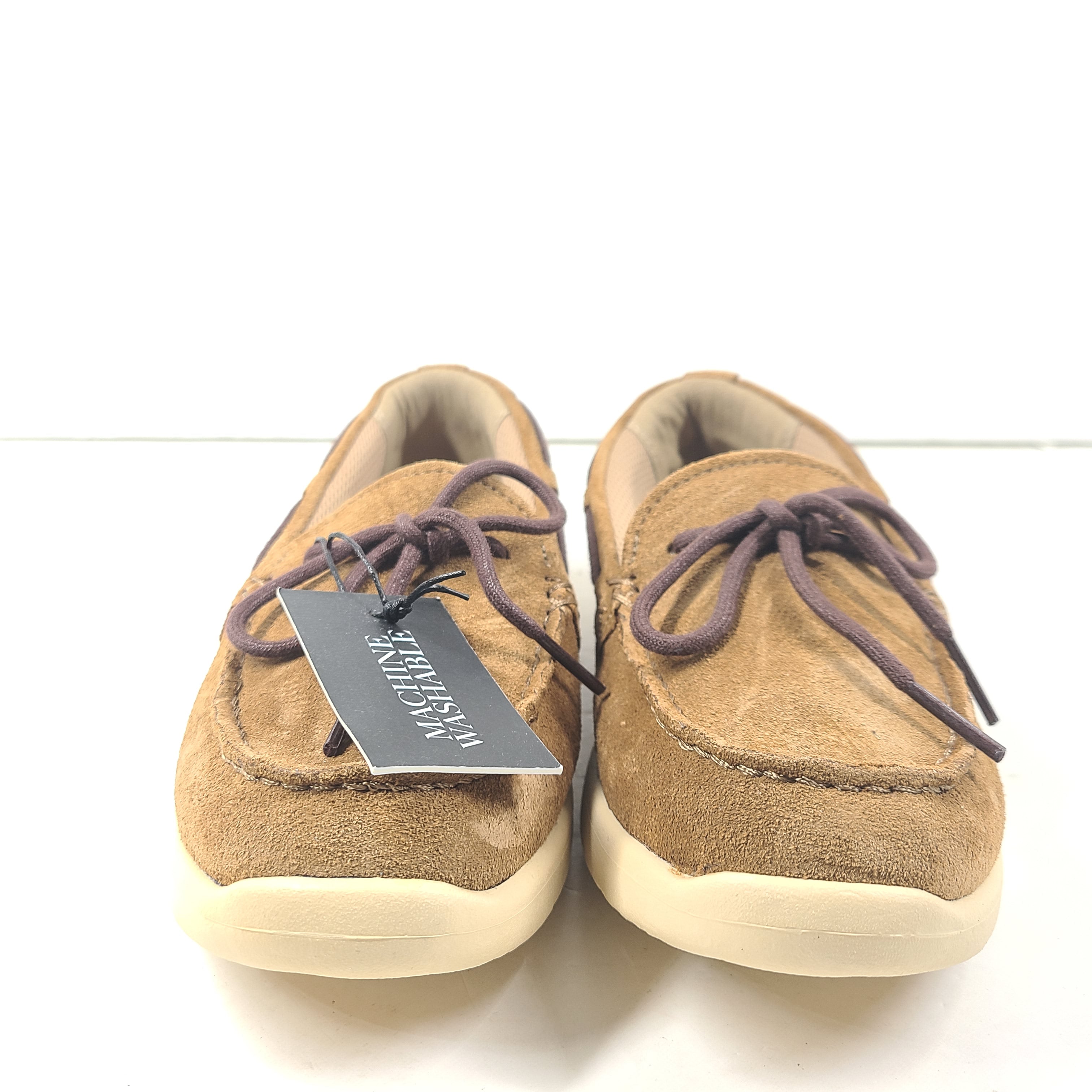UGG Beach Moc 1102757K in tan delivers a slip-on low-profile fit with cushioned comfort for everyday casual wear.
