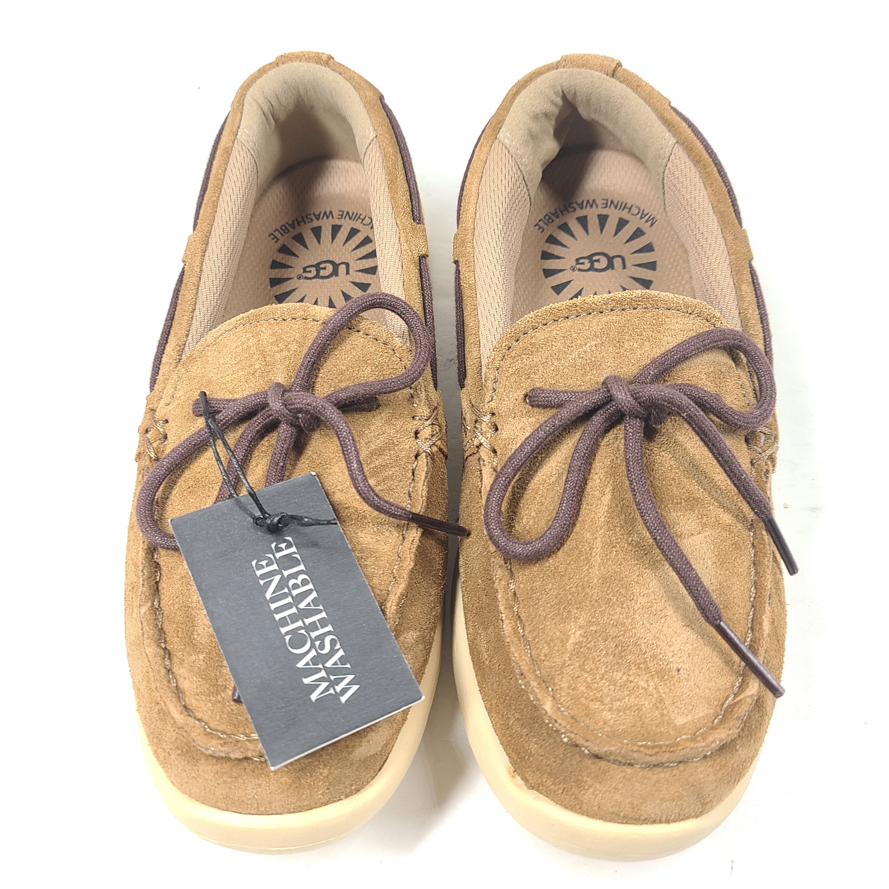 UGG Beach Moc 1102757K in tan delivers a slip-on low-profile fit with cushioned comfort for everyday casual wear.