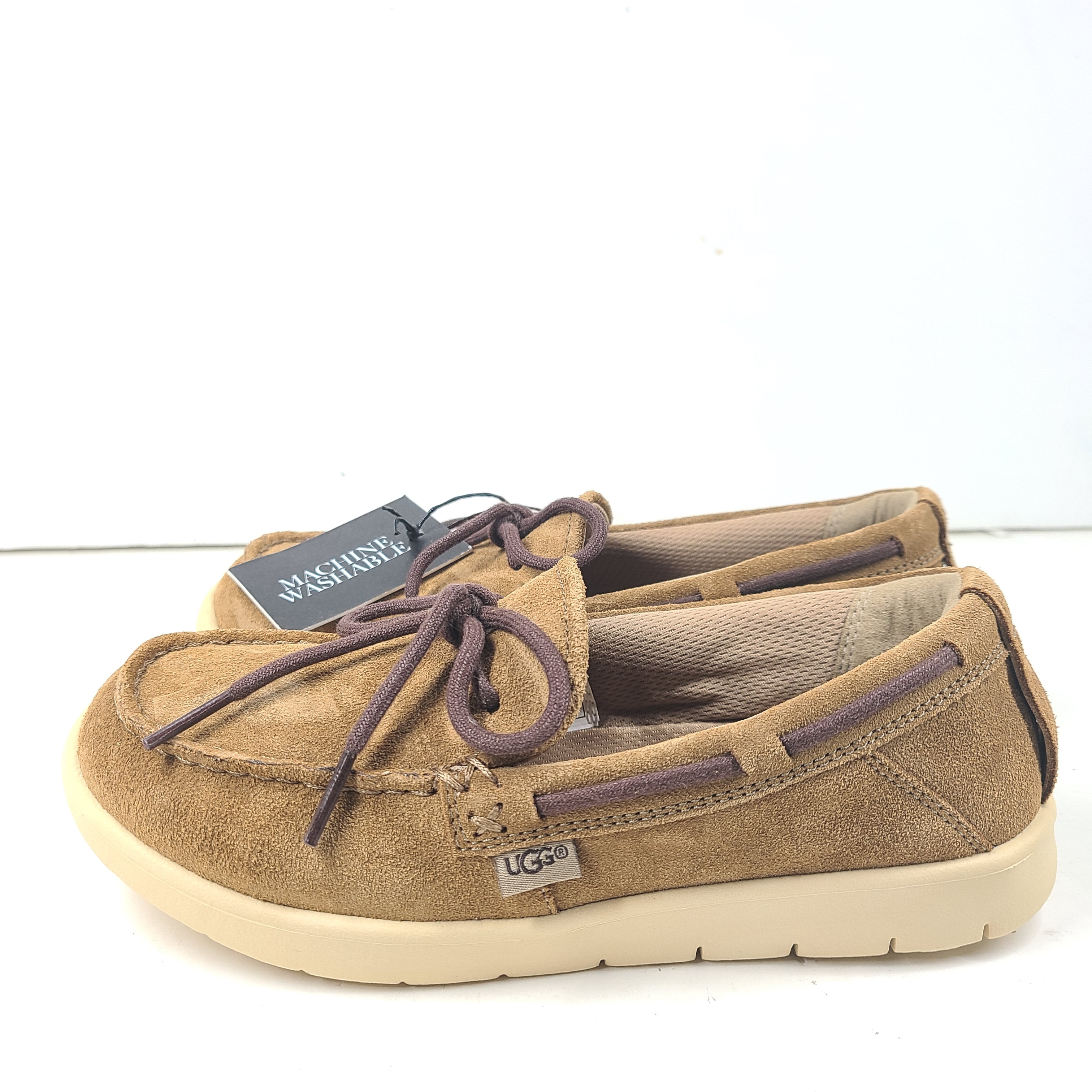 UGG Beach Moc 1102757K in tan delivers a slip-on low-profile fit with cushioned comfort for everyday casual wear.