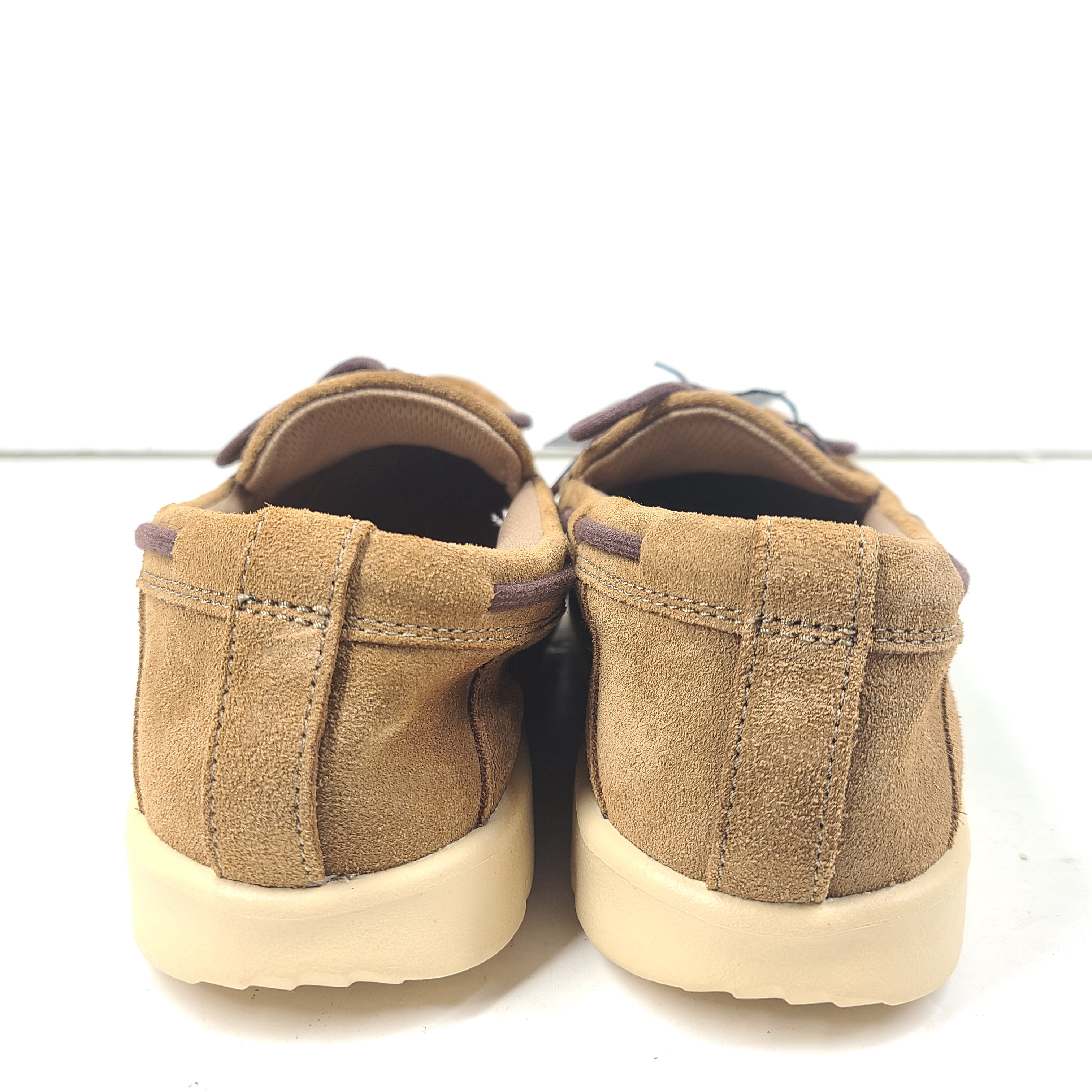 UGG Beach Moc 1102757K in tan delivers a slip-on low-profile fit with cushioned comfort for everyday casual wear.