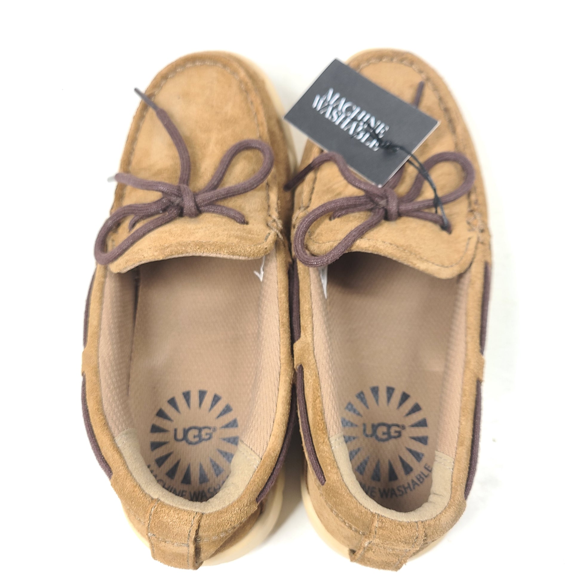 UGG Beach Moc 1102757K in tan delivers a slip-on low-profile fit with cushioned comfort for everyday casual wear.