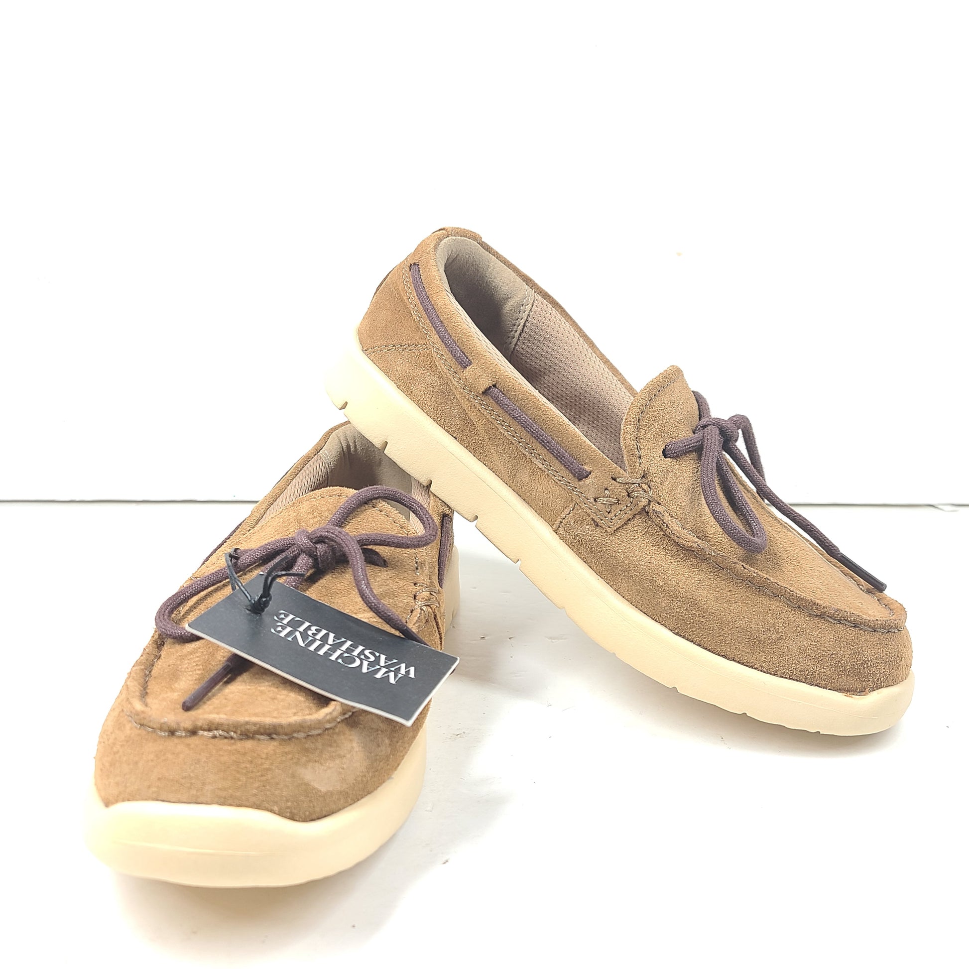 UGG Beach Moc 1102757K in tan delivers a slip-on low-profile fit with cushioned comfort for everyday casual wear.