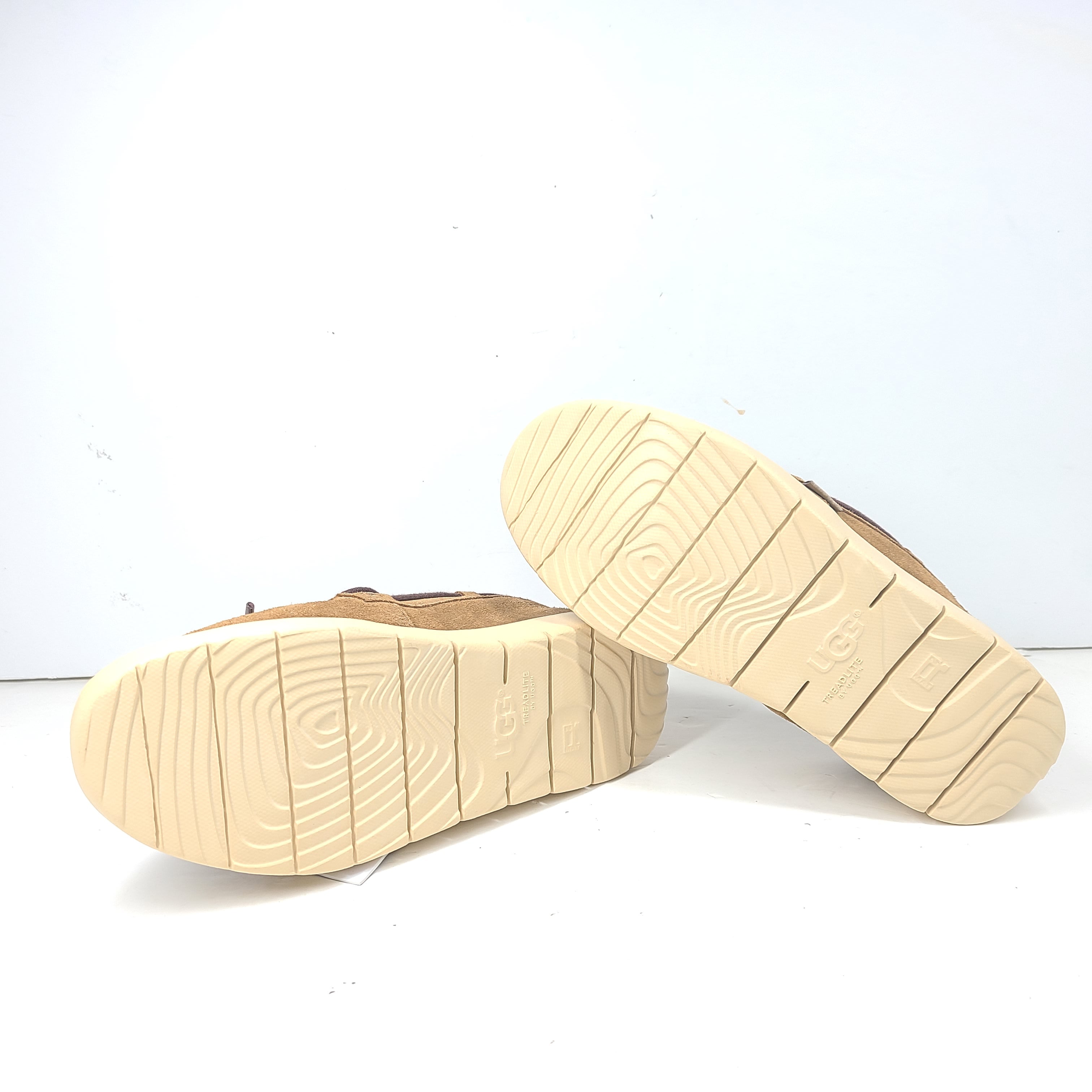 UGG Beach Moc 1102757K in tan delivers a slip-on low-profile fit with cushioned comfort for everyday casual wear.