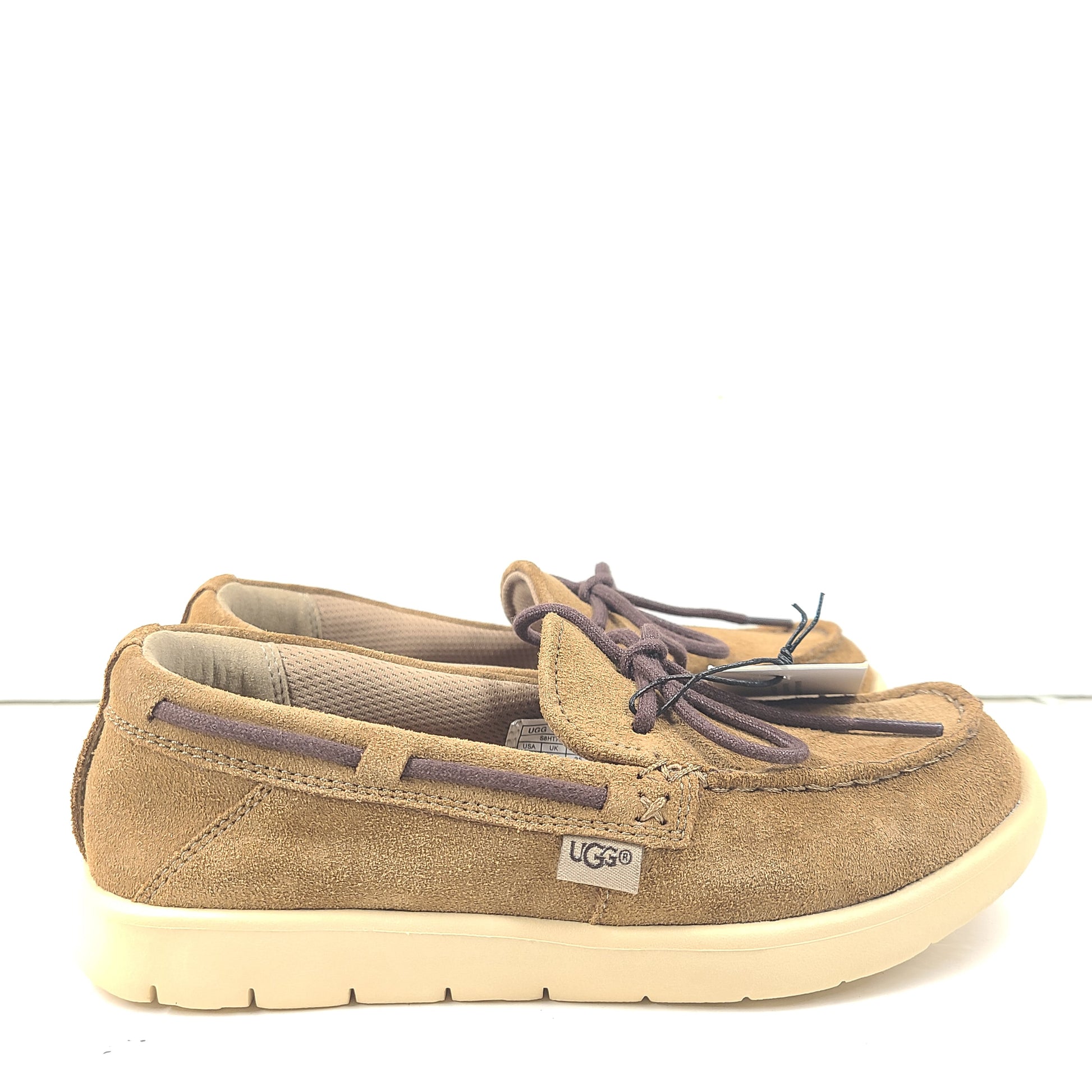 UGG Beach Moc 1102757K in tan delivers a slip-on low-profile fit with cushioned comfort for everyday casual wear.