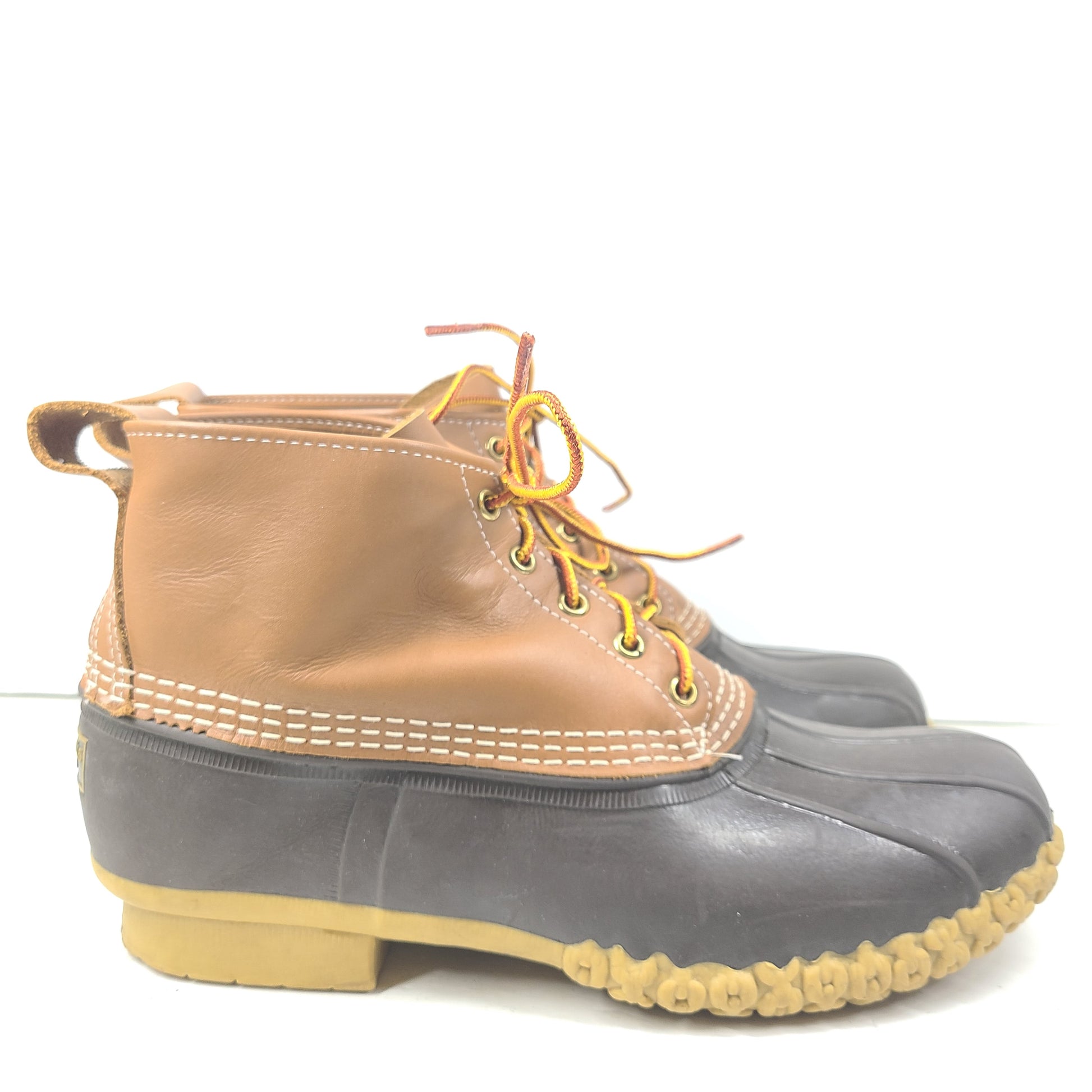 Classic L.L. Bean brown and tan leather boots that offer durable outdoor traction and timeless style.