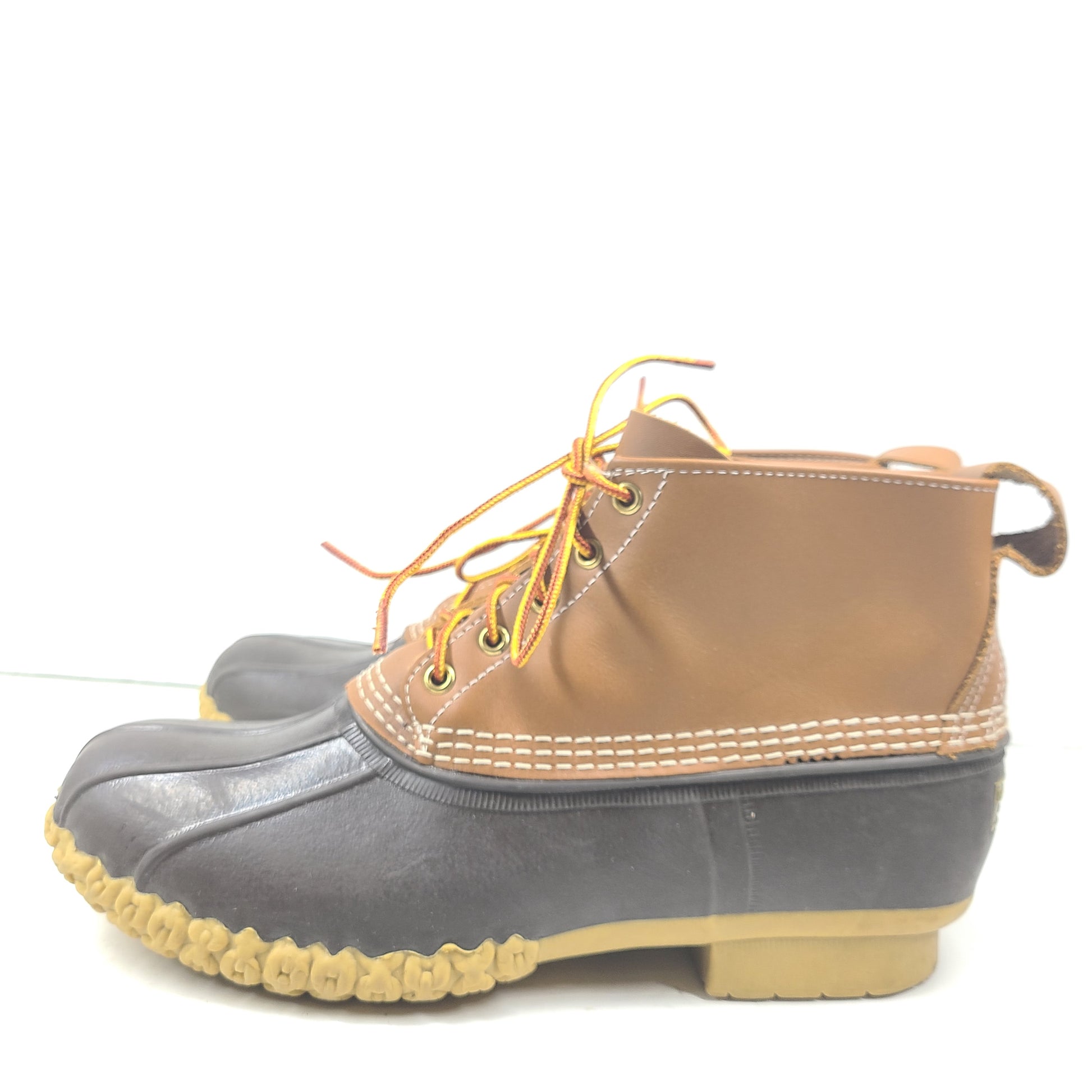 Classic L.L. Bean brown and tan leather boots that offer durable outdoor traction and timeless style.