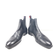 Black leather Chelsea boots by Hugo Boss with a sleek ankle silhouette and branded insole.