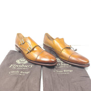 Brown Goodyear-welted leather dress shoes with a refined rounded silhouette and stacked heel.