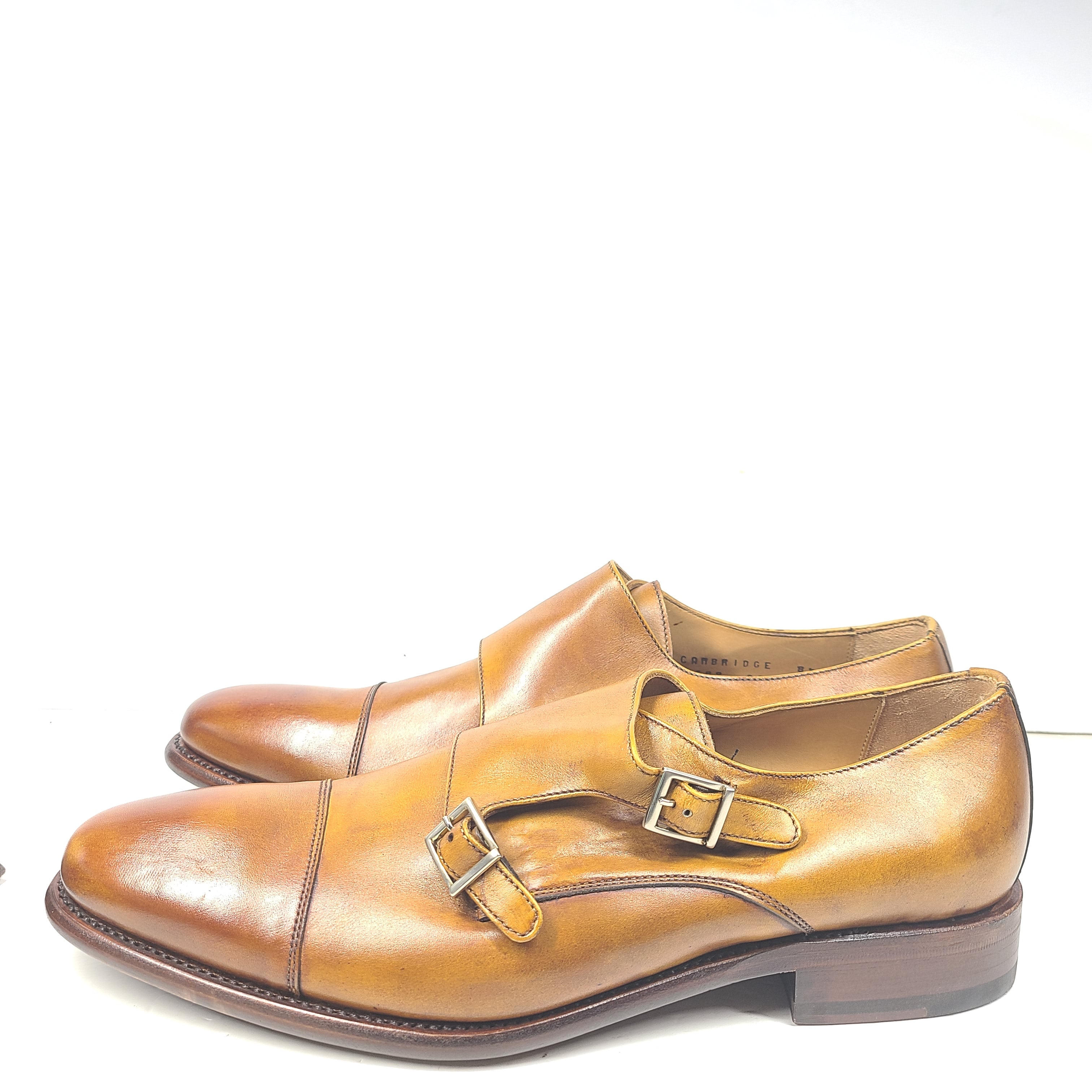 Brown Goodyear-welted leather dress shoes with a refined rounded silhouette and stacked heel.