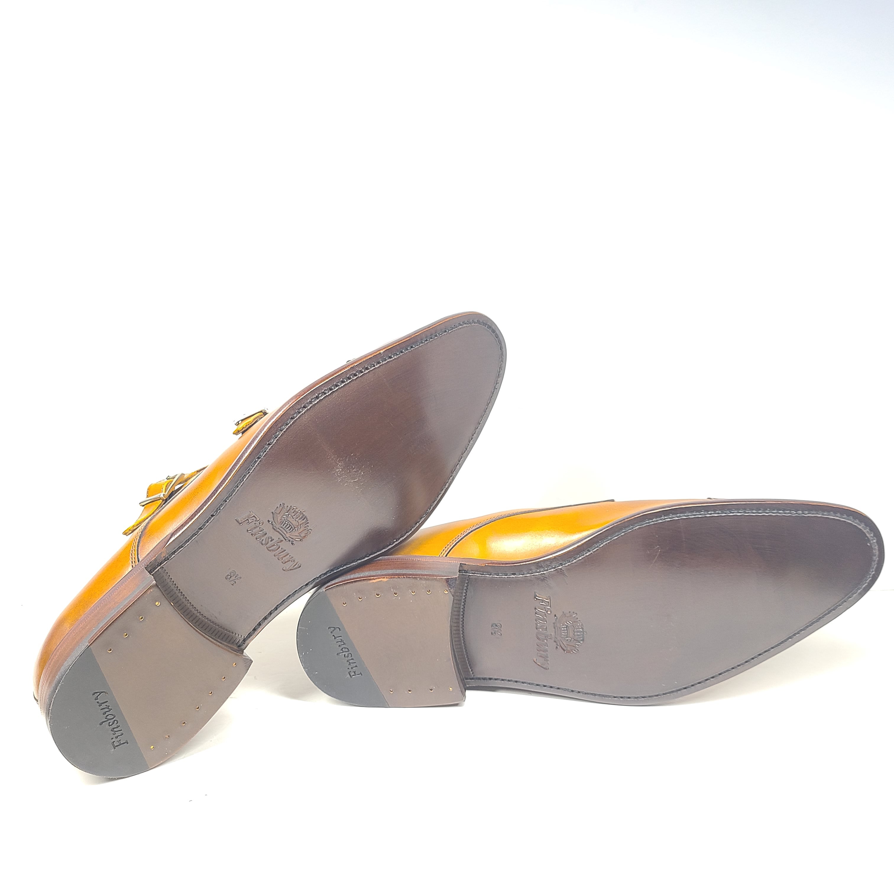 Brown Goodyear-welted leather dress shoes with a refined rounded silhouette and stacked heel.