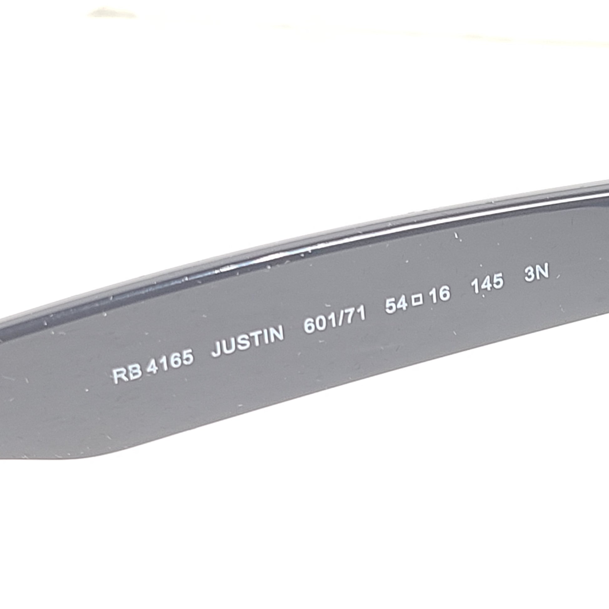 Classic Ray-Ban Justin RB4165 unisex sunglasses in matte black deliver a confident square profile with comfortable all-day wear.