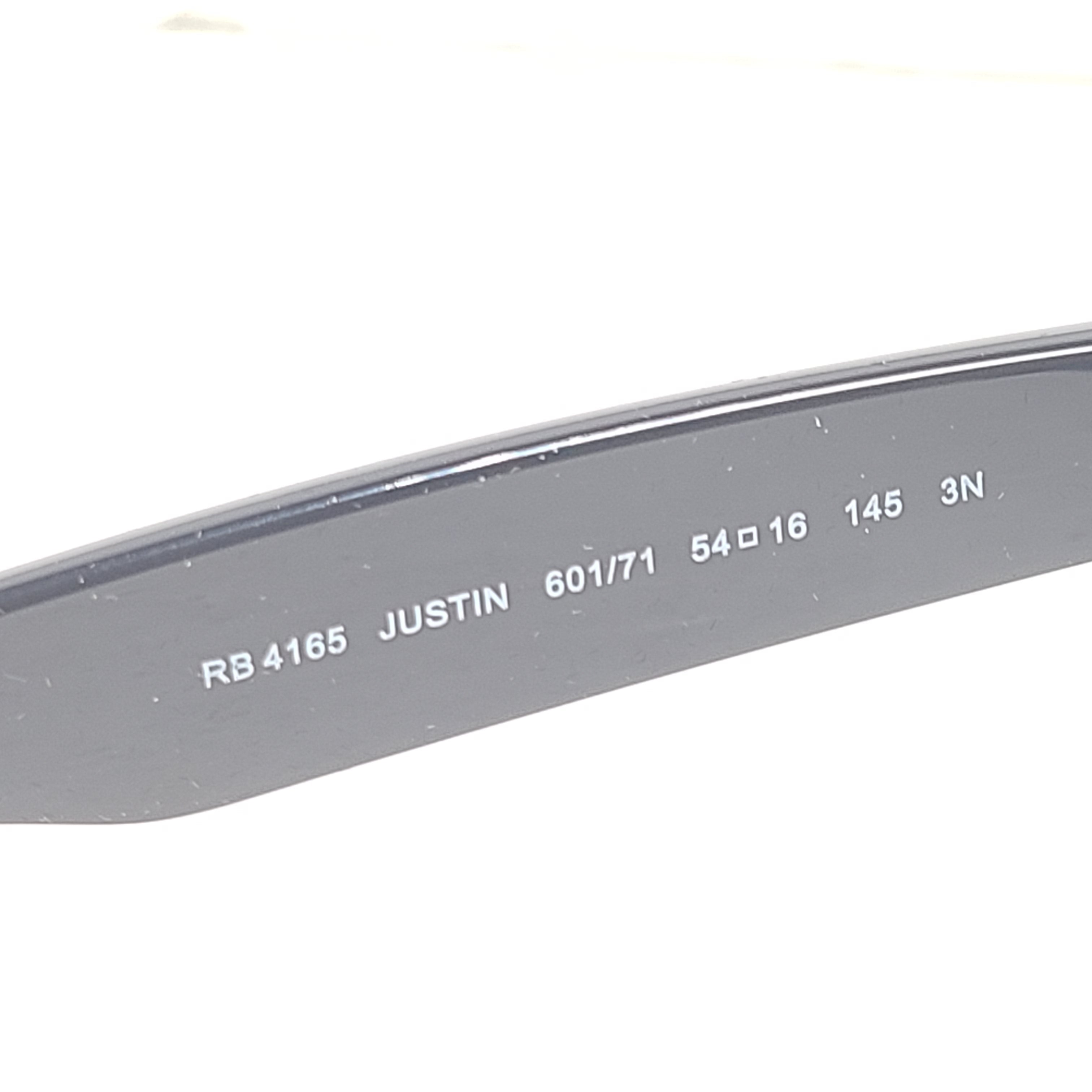 Classic Ray-Ban Justin RB4165 unisex sunglasses in matte black deliver a confident square profile with comfortable all-day wear.