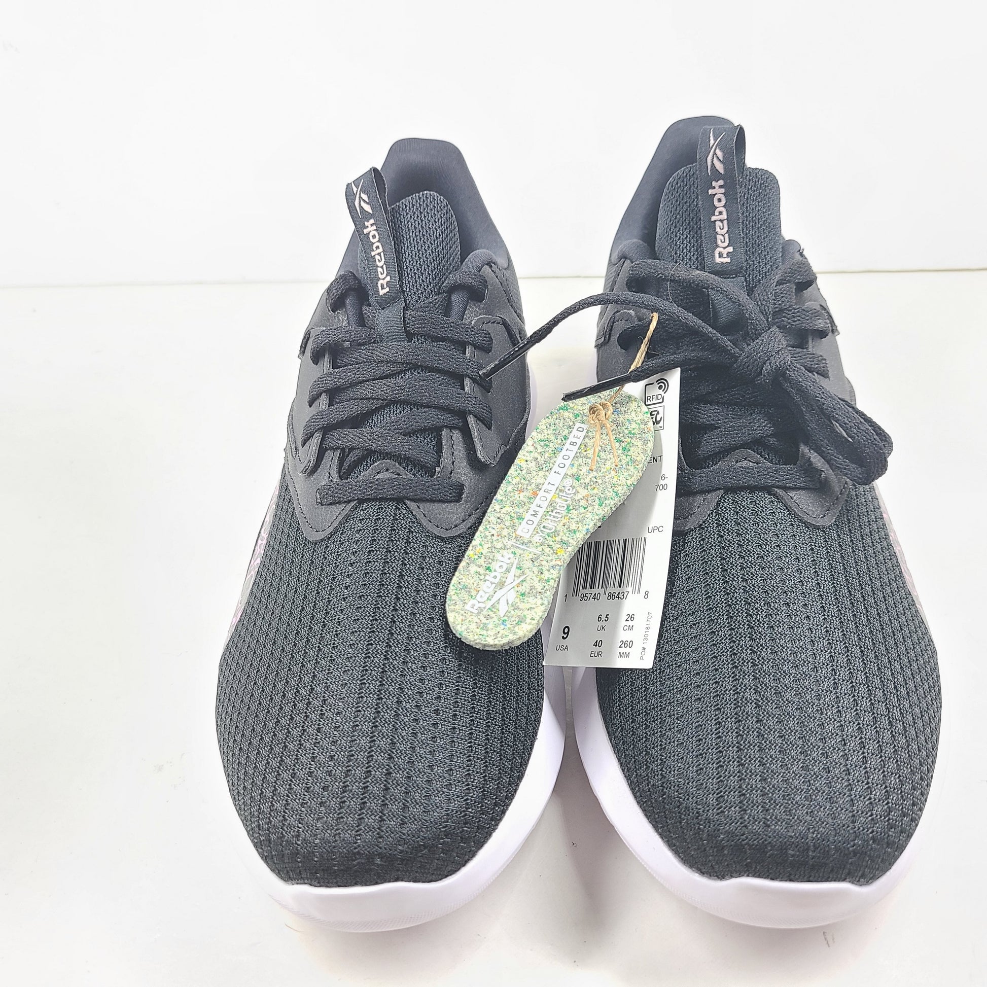 Sleek Reebok Fluxlite GY4052 women's trainers in black, pink and white that offer lightweight support and everyday comfort.