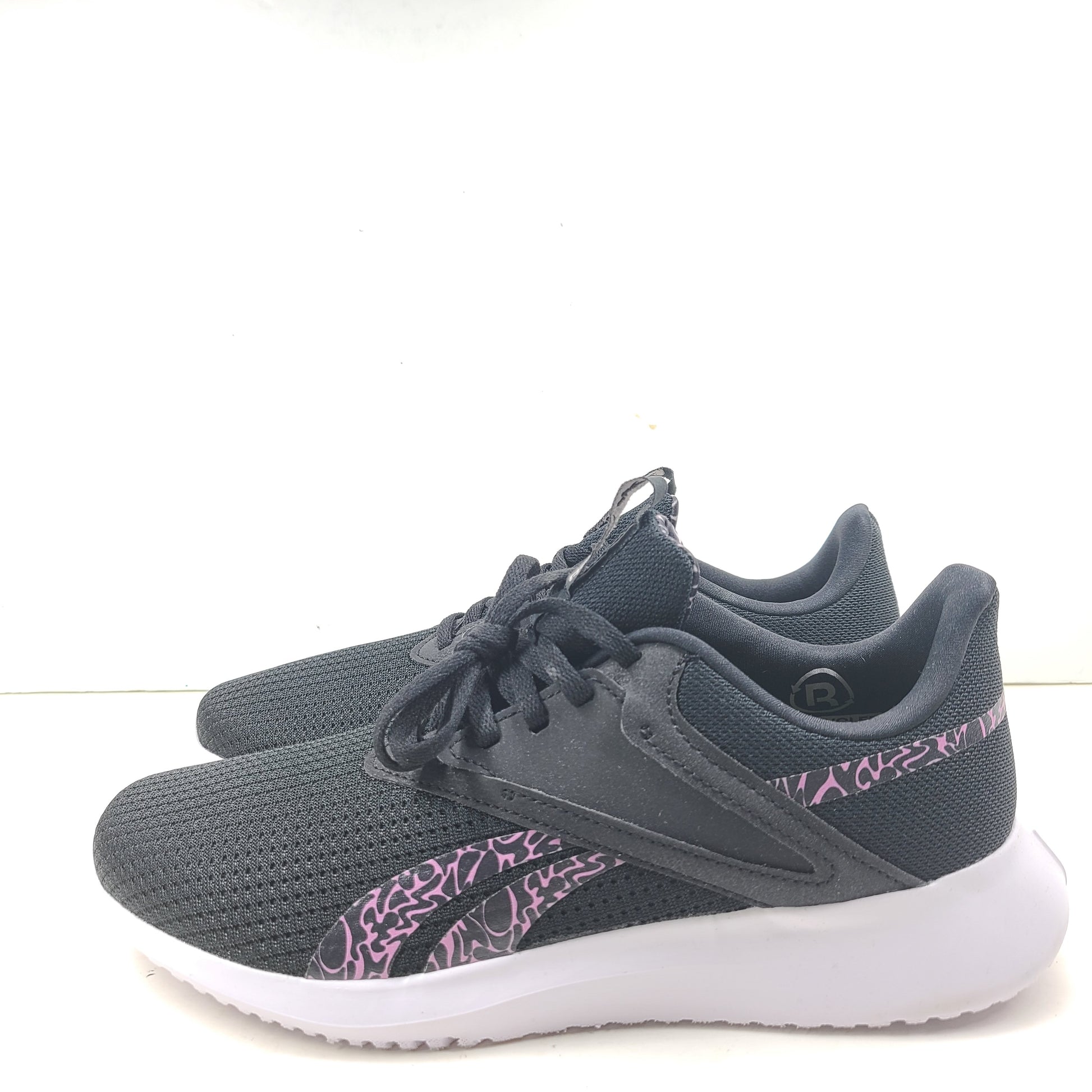 Sleek Reebok Fluxlite GY4052 women's trainers in black, pink and white that offer lightweight support and everyday comfort.