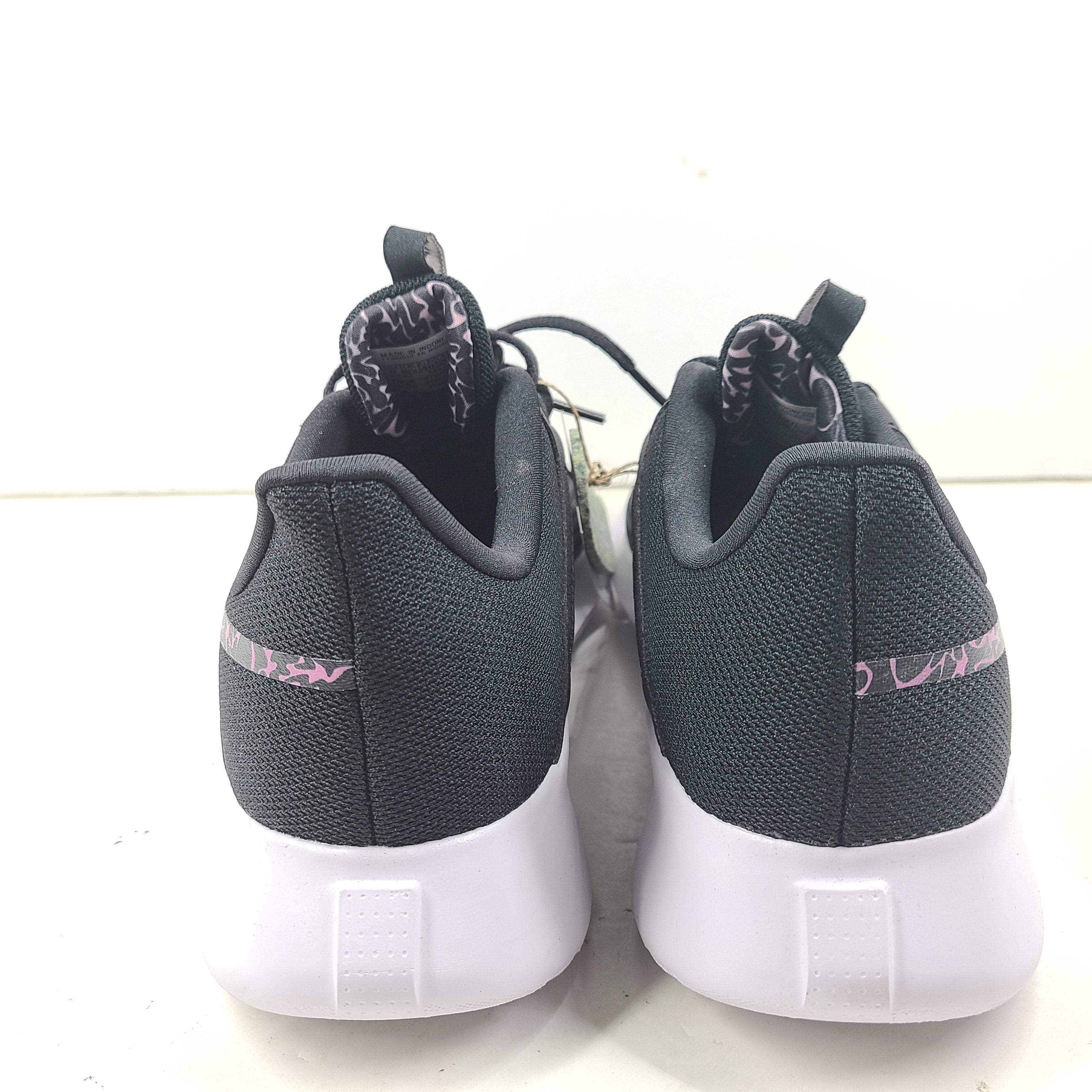 Sleek Reebok Fluxlite GY4052 women's trainers in black, pink and white that offer lightweight support and everyday comfort.
