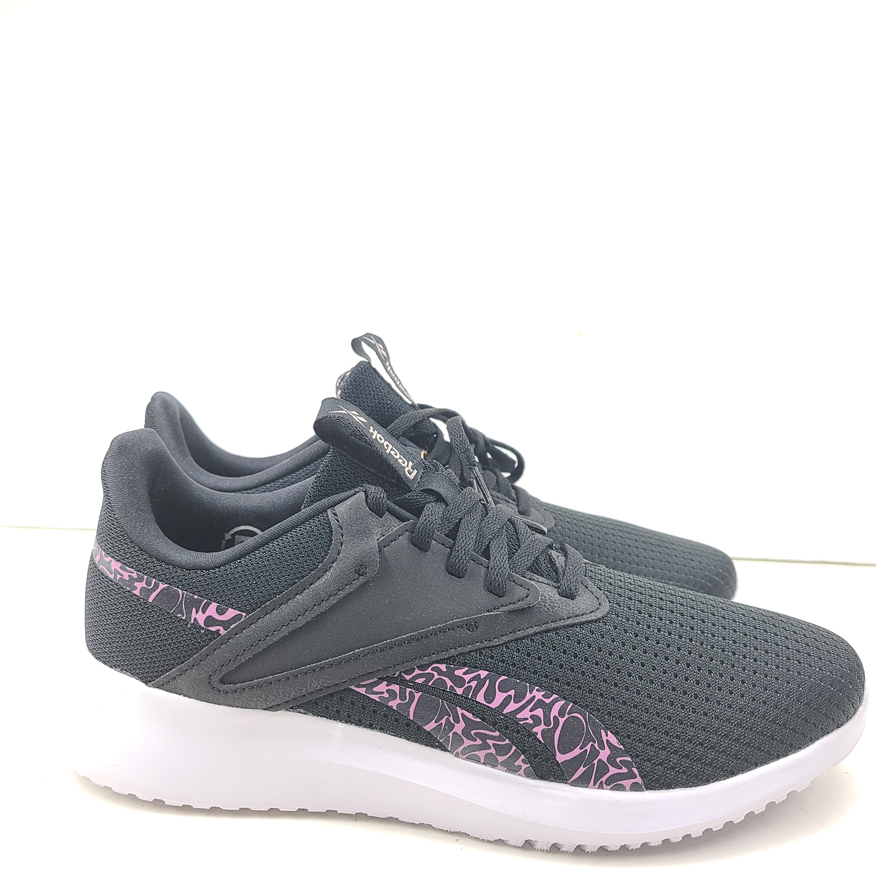 Sleek Reebok Fluxlite GY4052 women's trainers in black, pink and white that offer lightweight support and everyday comfort.