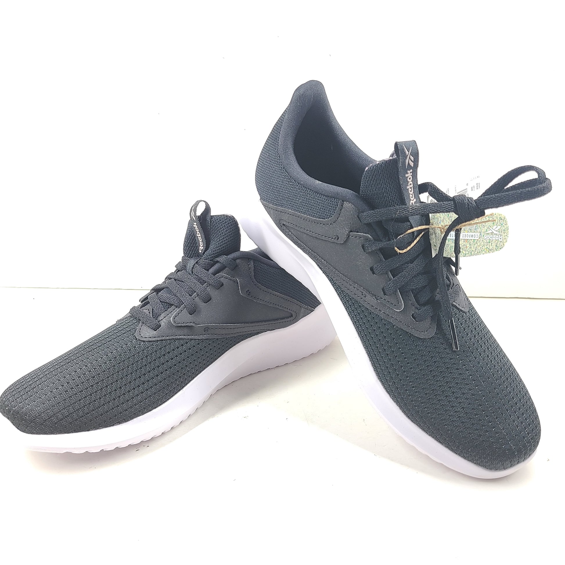 Sleek Reebok Fluxlite GY4052 women's trainers in black, pink and white that offer lightweight support and everyday comfort.