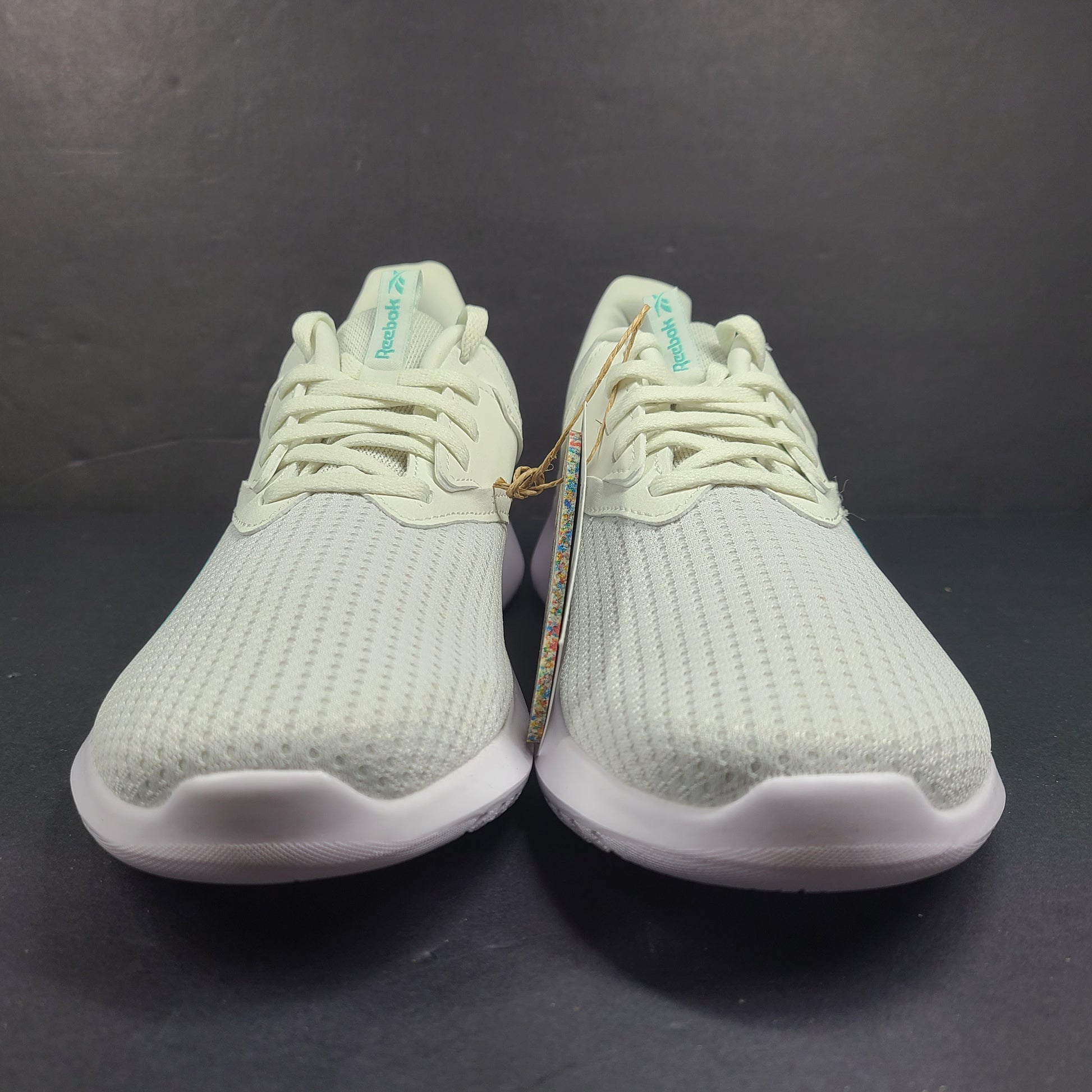 Lightweight Reebok Fluxlite training shoes in gray and teal, US size 9, built for everyday performance.