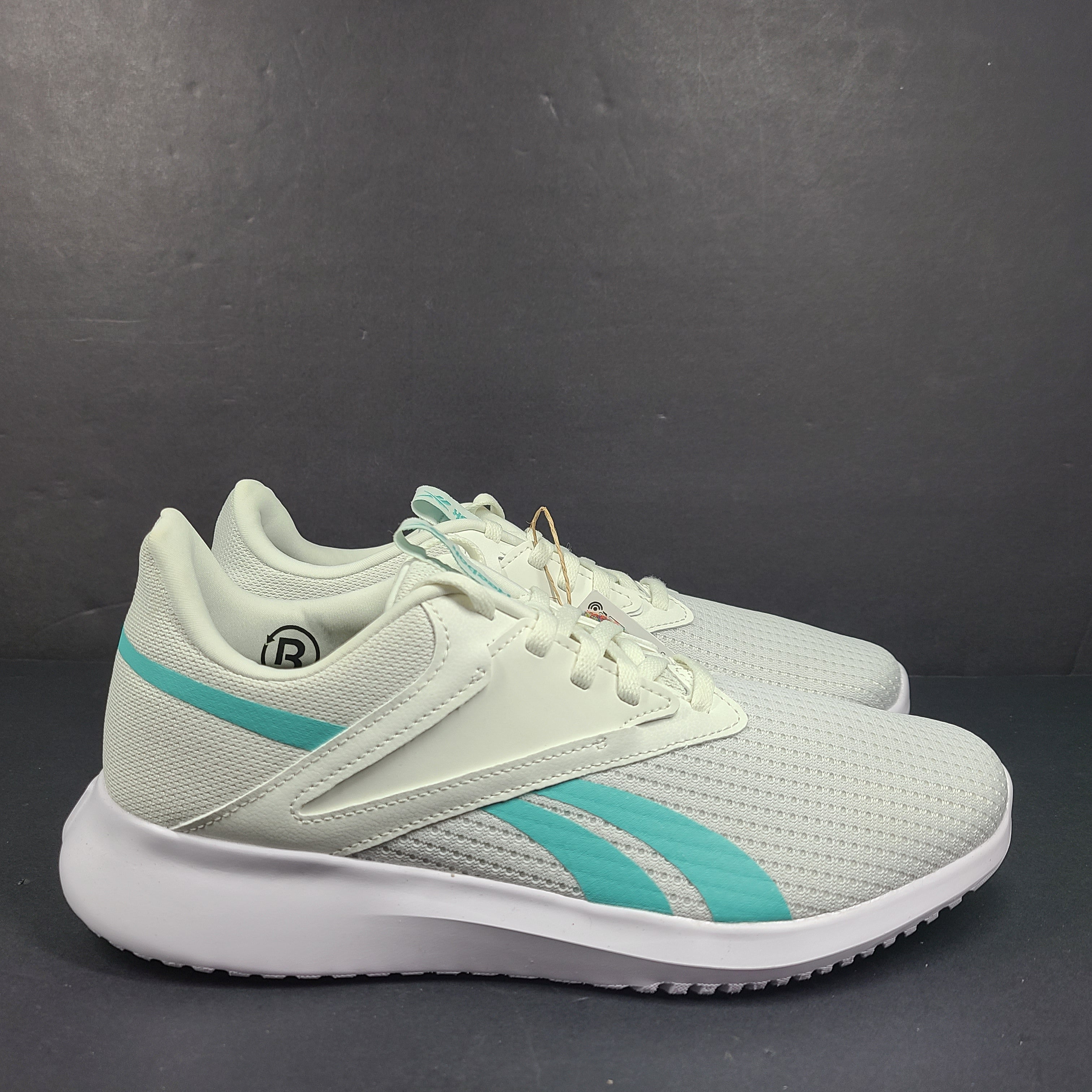 Lightweight Reebok Fluxlite training shoes in gray and teal, US size 9, built for everyday performance.