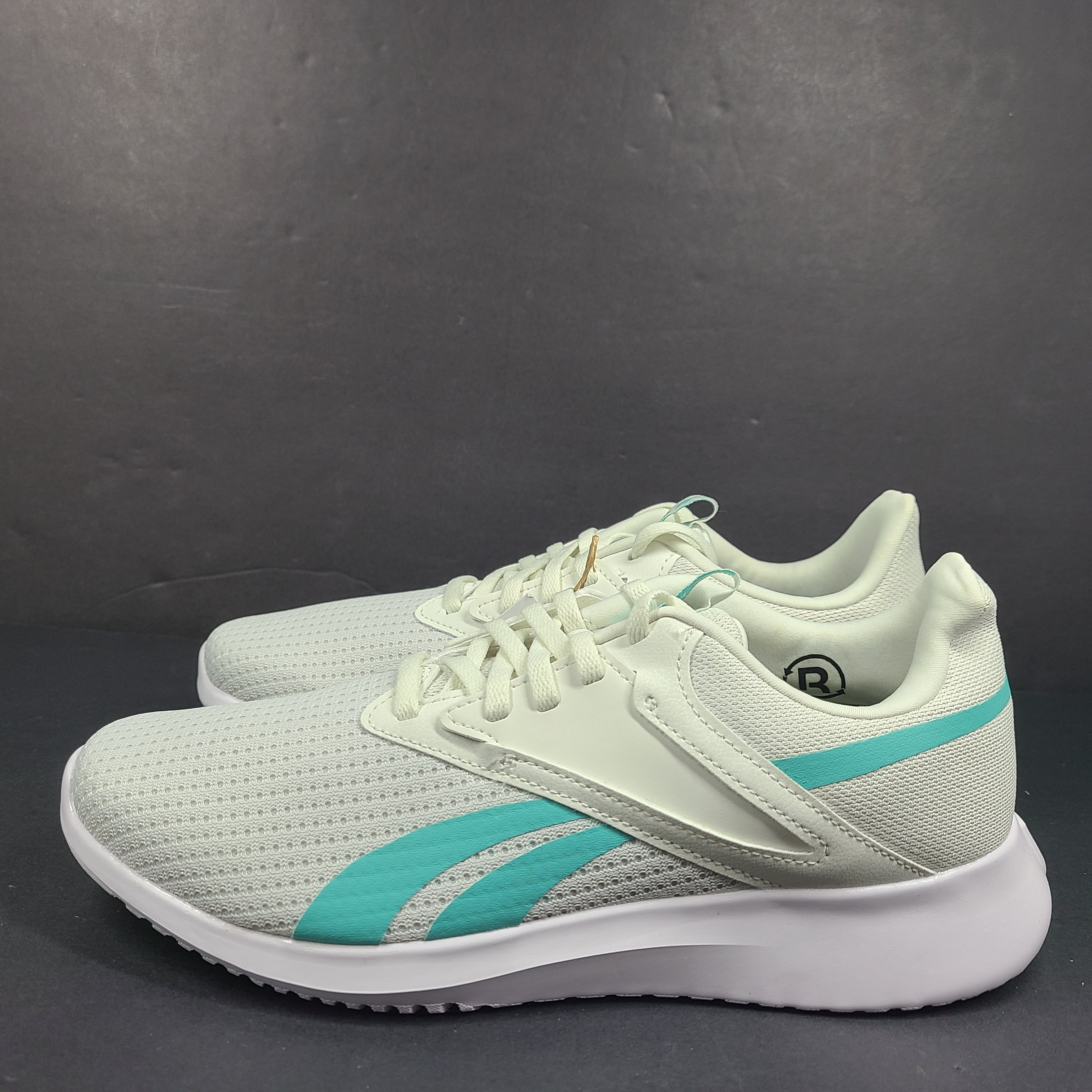 Lightweight Reebok Fluxlite training shoes in gray and teal, US size 9, built for everyday performance.