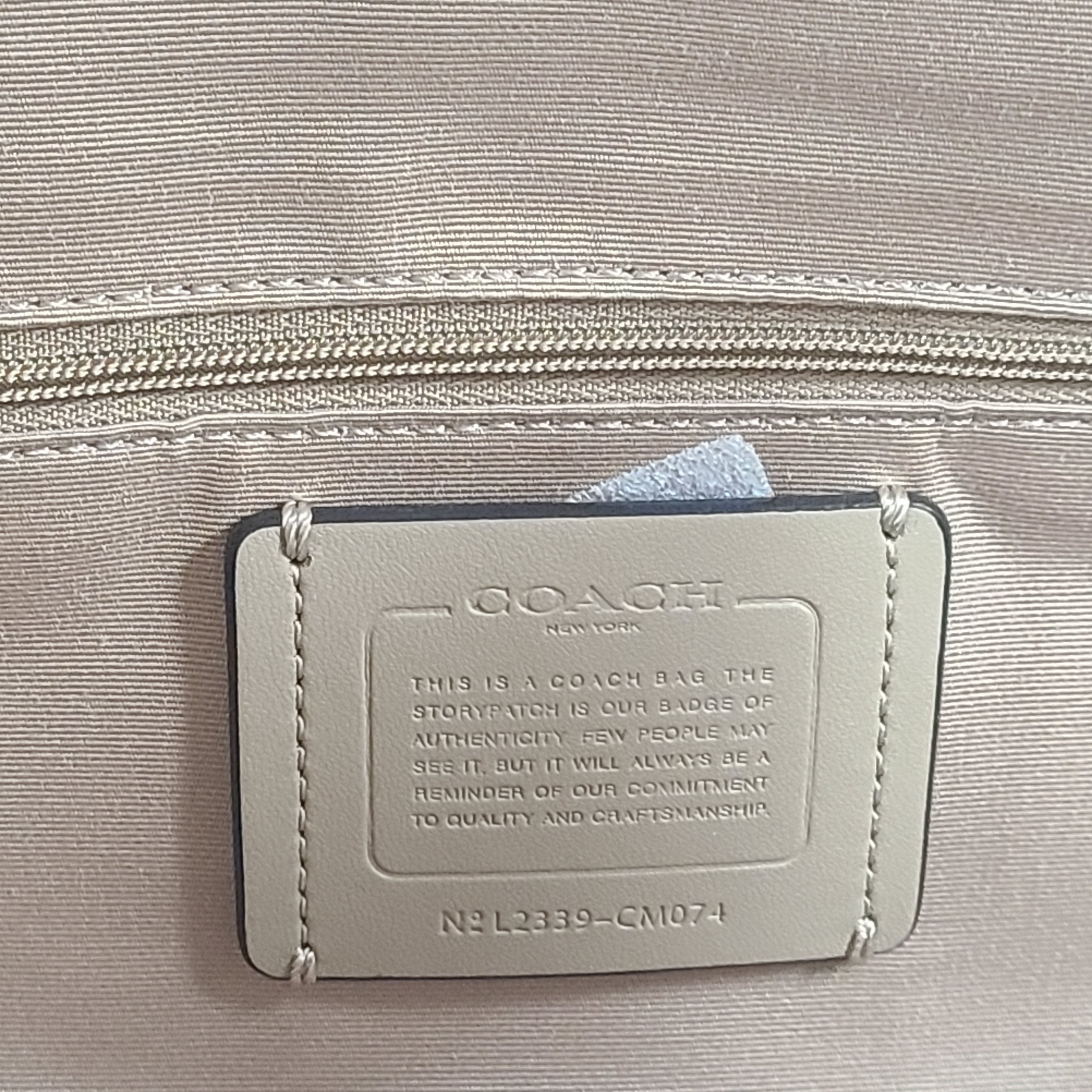 Coach Meadow pebble leather tote in Chalk, model CM074, designed for everyday carry.