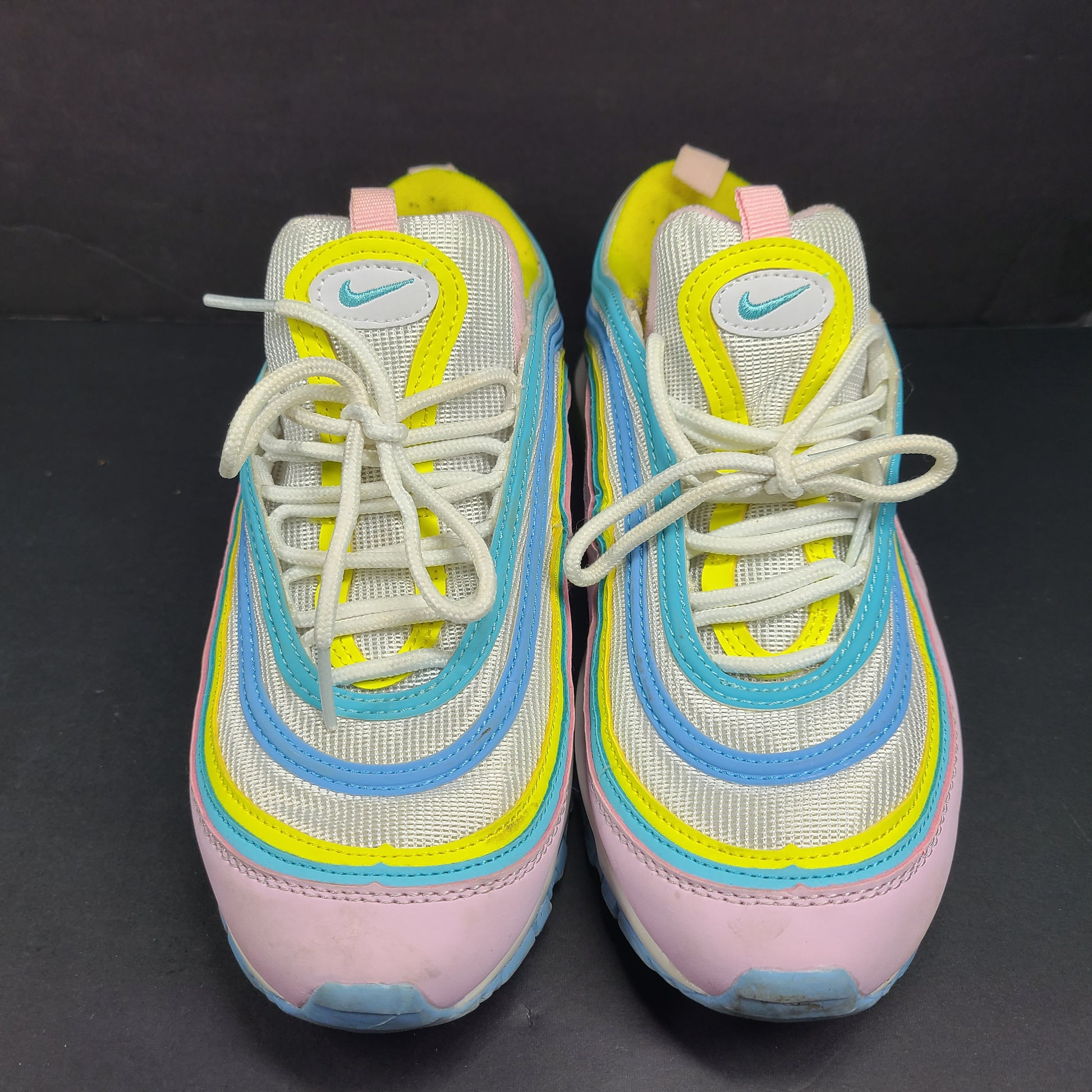 Nike Air Max 97 Multicolor in pastel pink, blue, yellow and white with signature full-length Air Max cushioning for comfortable wear.