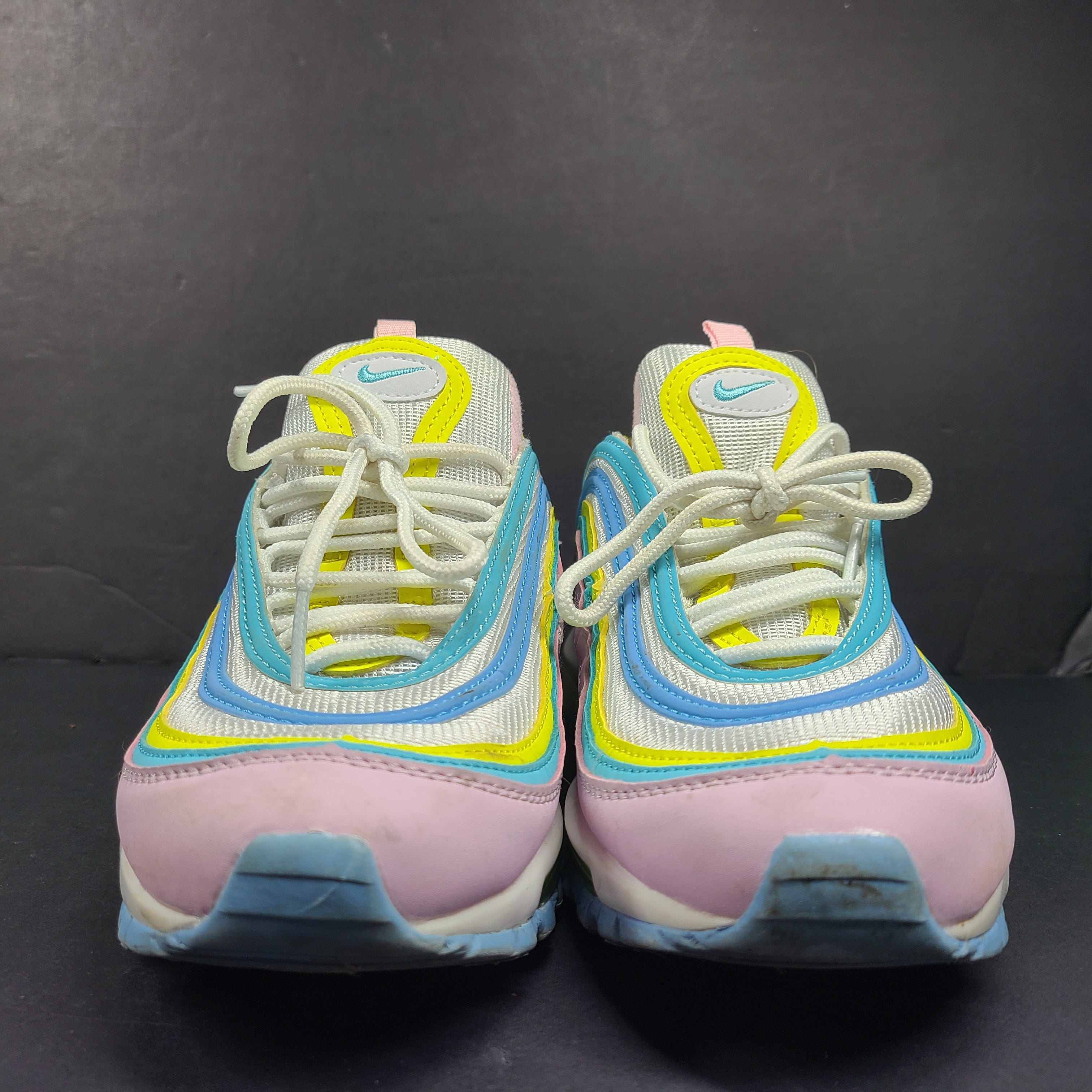 Nike Air Max 97 Multicolor in pastel pink, blue, yellow and white with signature full-length Air Max cushioning for comfortable wear.