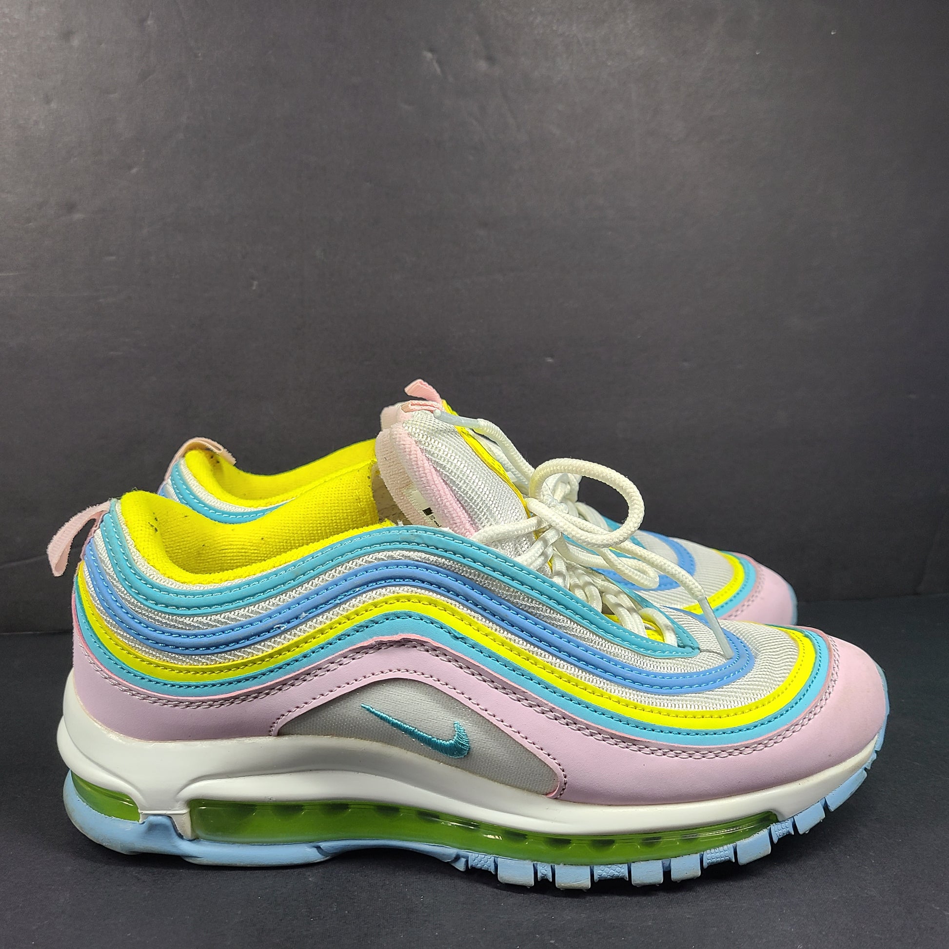 Nike Air Max 97 Multicolor in pastel pink, blue, yellow and white with signature full-length Air Max cushioning for comfortable wear.