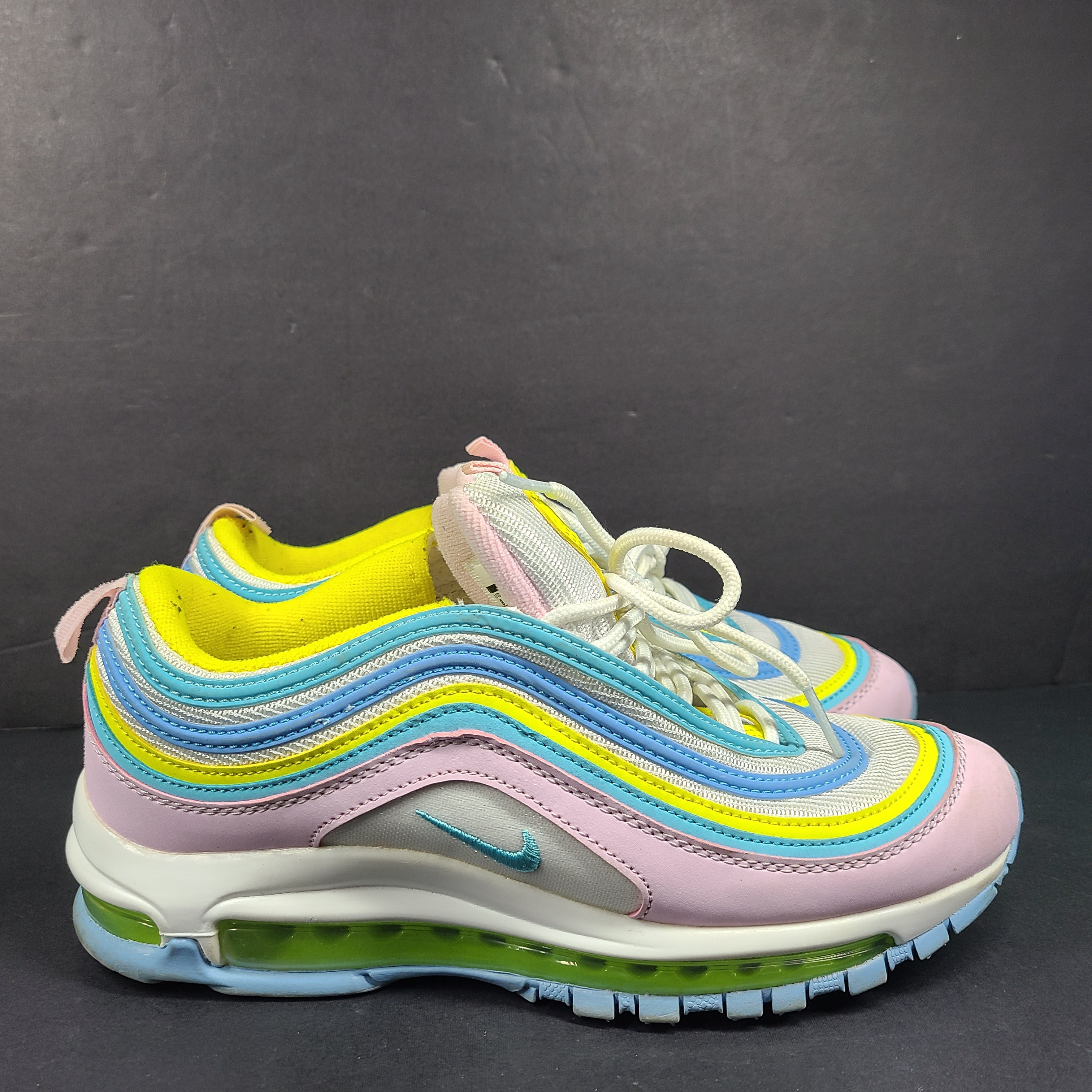 Nike Air Max 97 Multicolor in pastel pink, blue, yellow and white with signature full-length Air Max cushioning for comfortable wear.