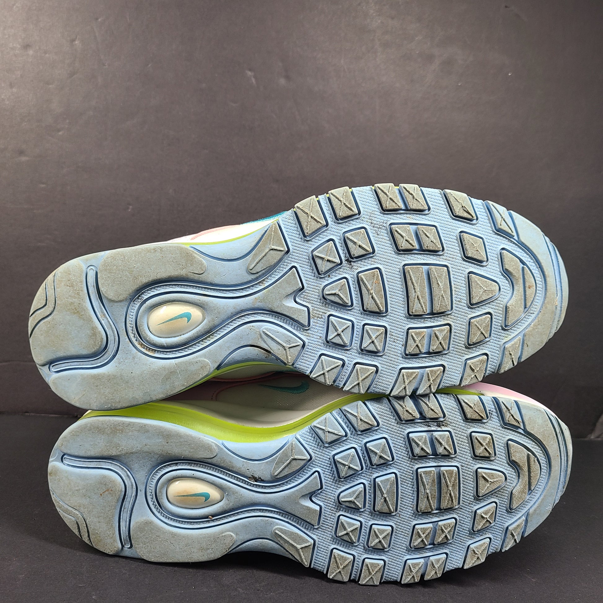 Nike Air Max 97 Multicolor in pastel pink, blue, yellow and white with signature full-length Air Max cushioning for comfortable wear.