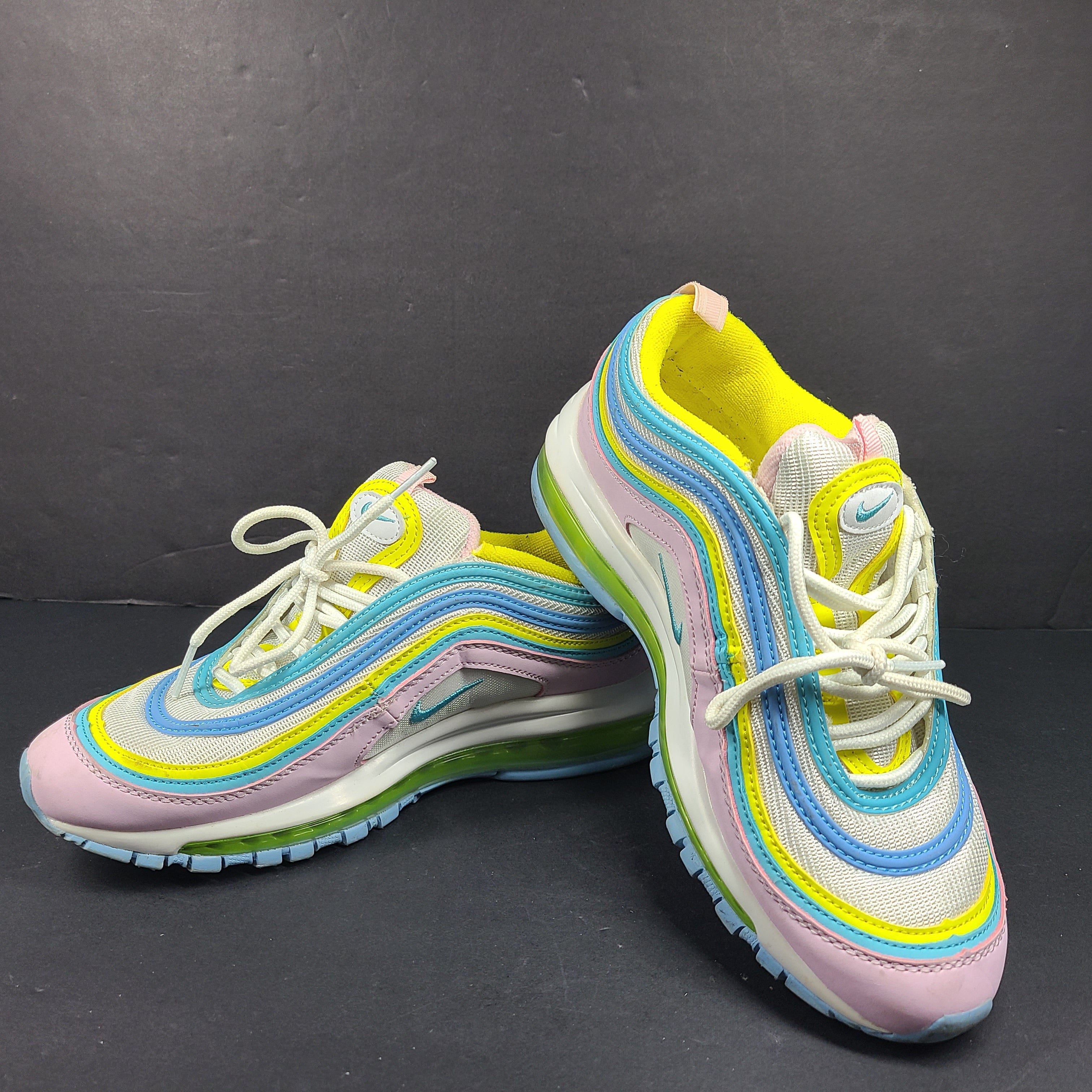 Nike Air Max 97 Multicolor in pastel pink, blue, yellow and white with signature full-length Air Max cushioning for comfortable wear.