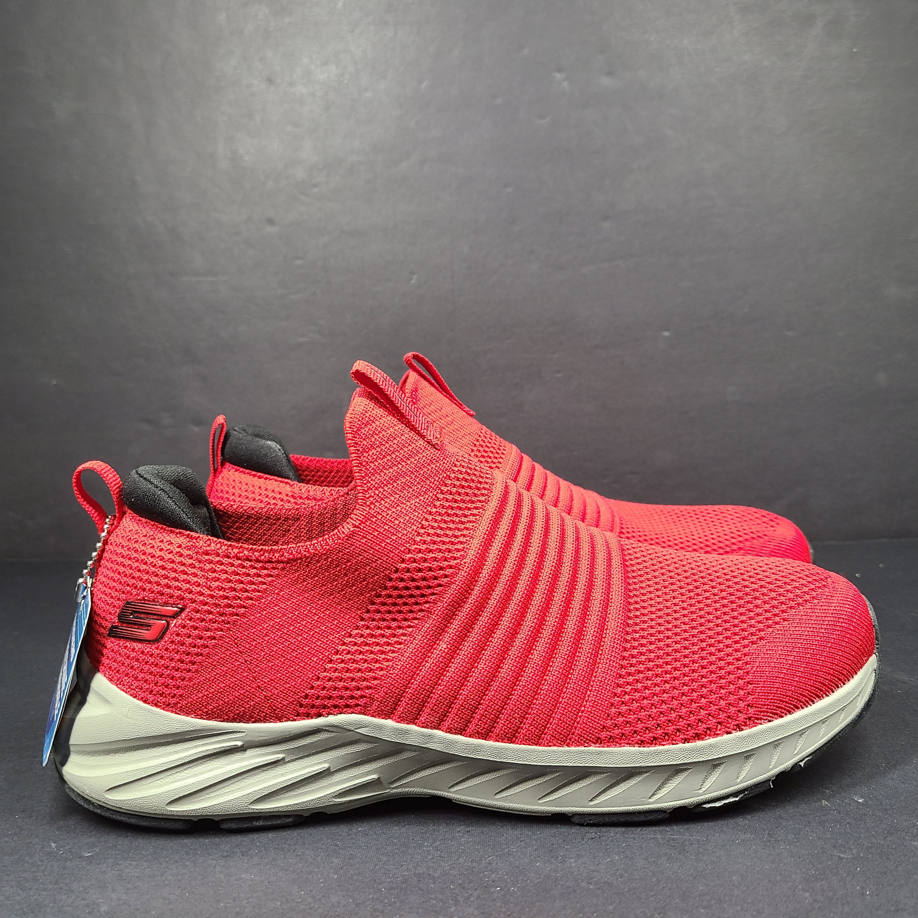 Red Skechers SKX Air-Cooled Memory Foam sneakers in US size 5.5 with cushioned support.