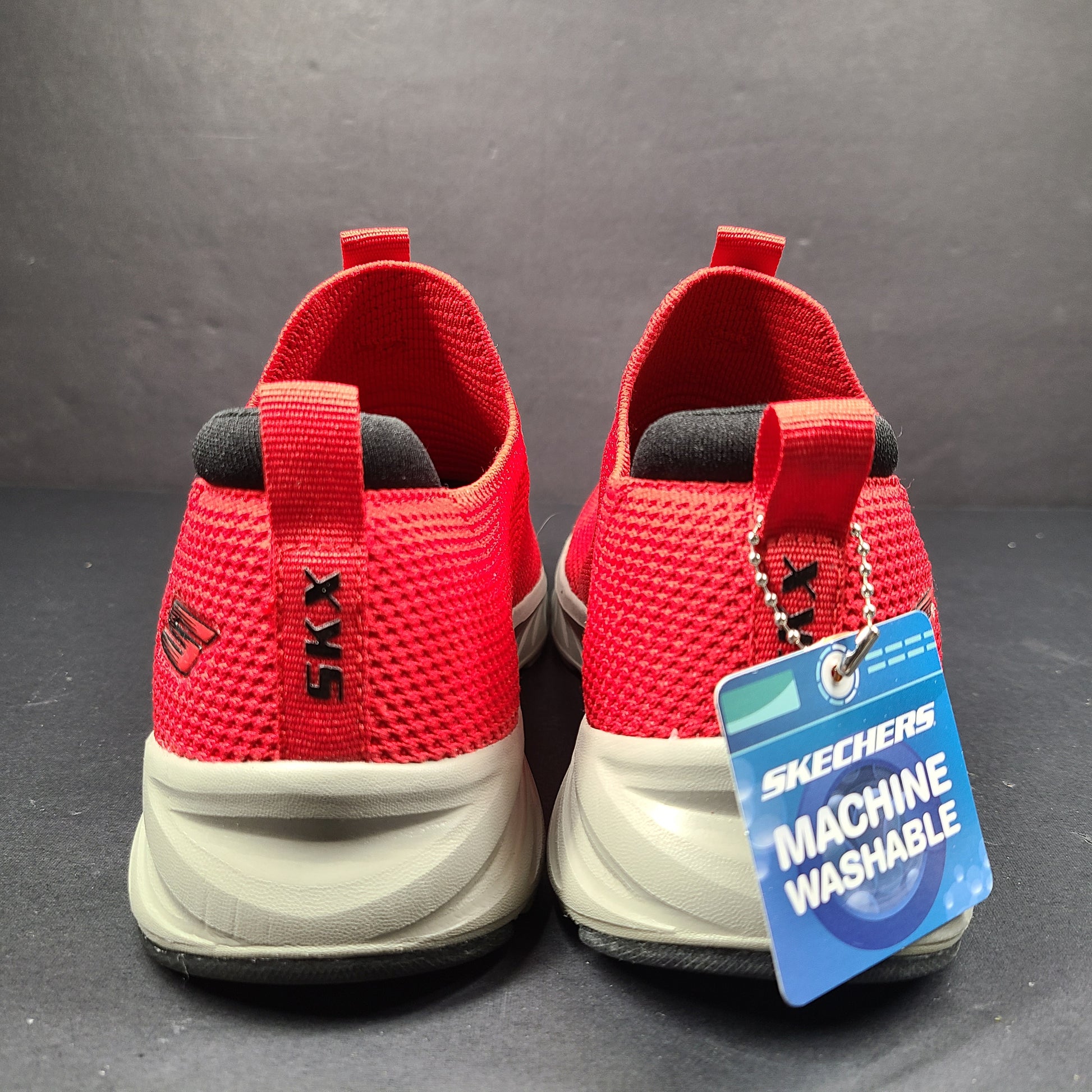Red Skechers SKX Air-Cooled Memory Foam sneakers in US size 5.5 with cushioned support.