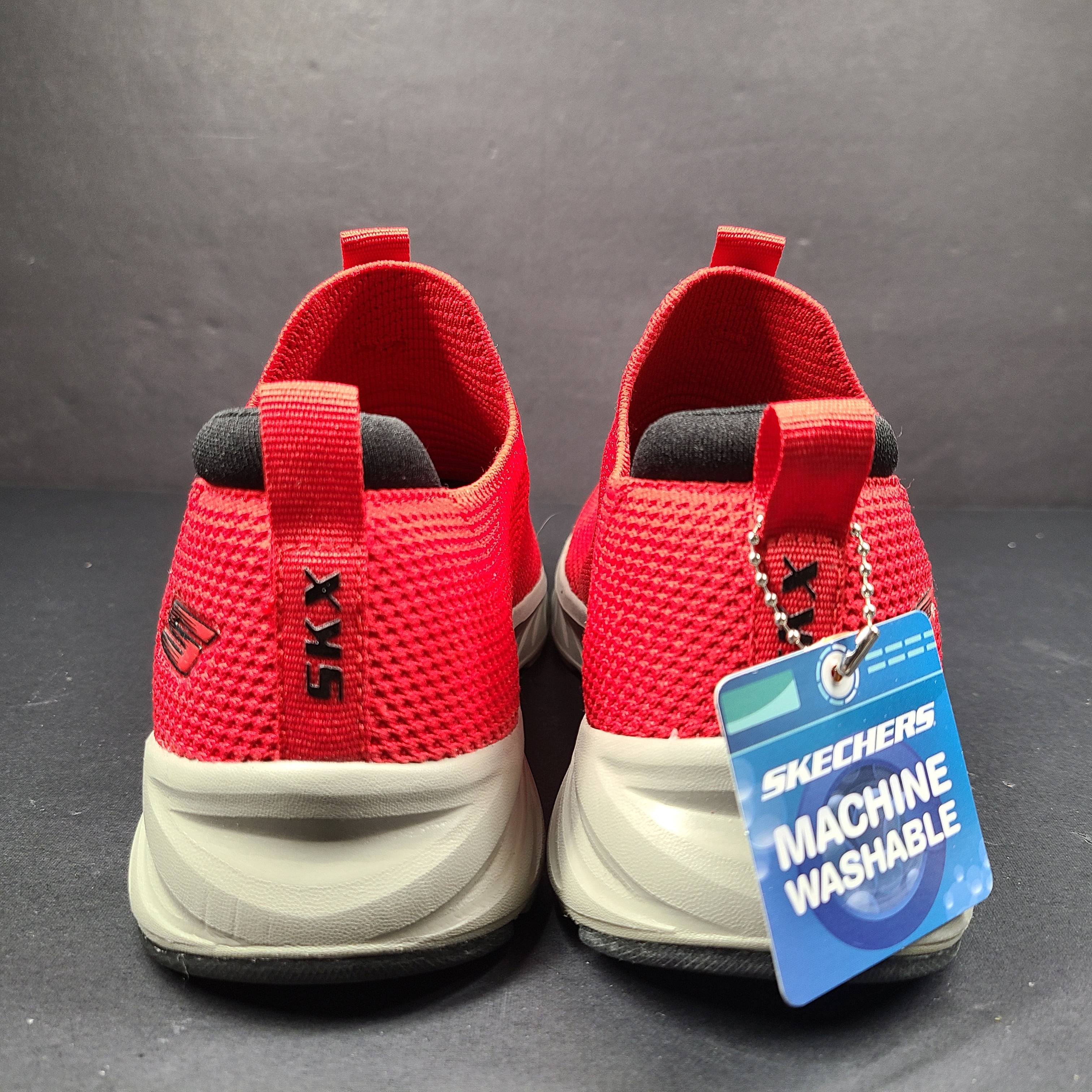Red Skechers SKX Air-Cooled Memory Foam sneakers in US size 5.5 with cushioned support.