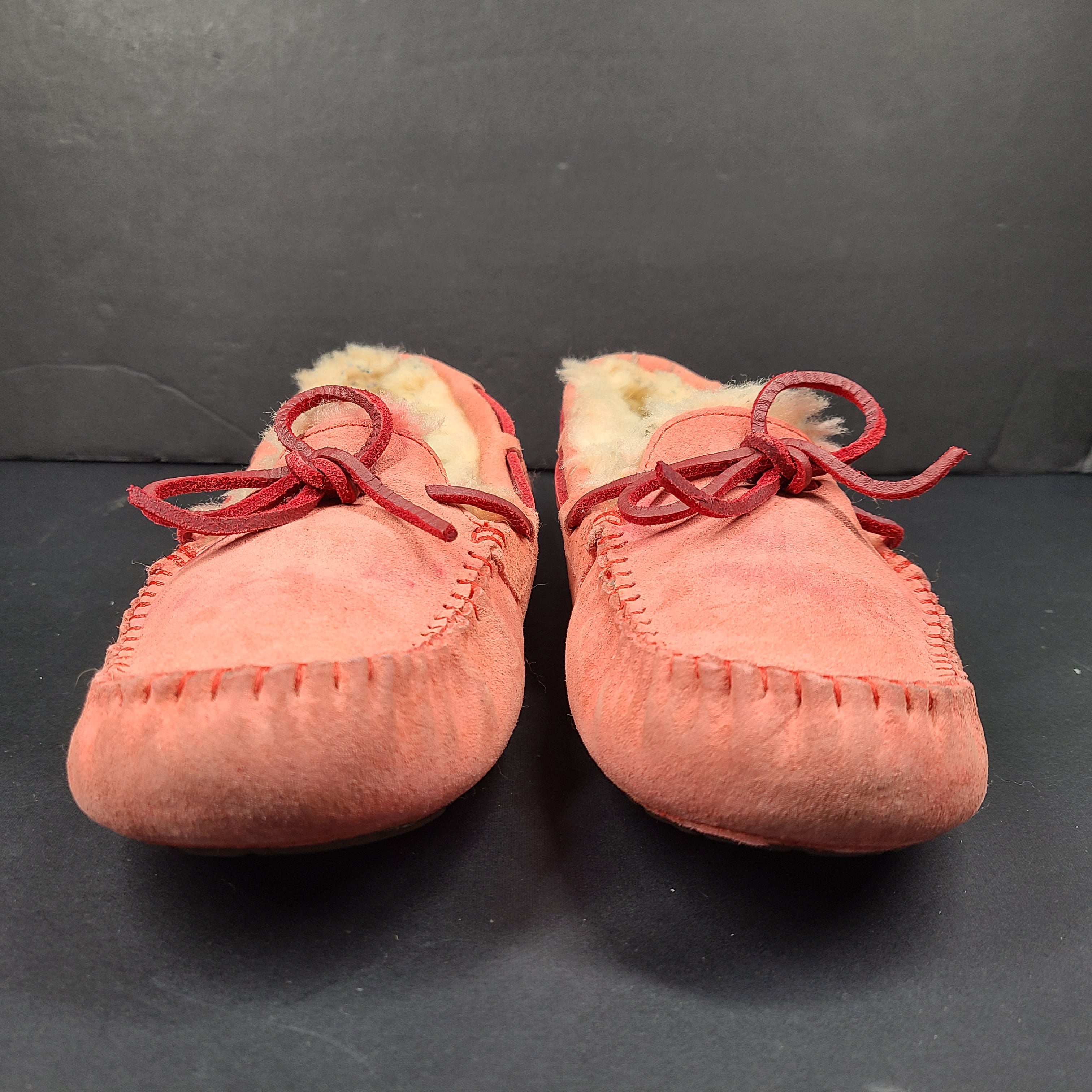 UGG Dakota moccasin slippers in pink suede for women's US 7 with soft lining and classic silhouette.
