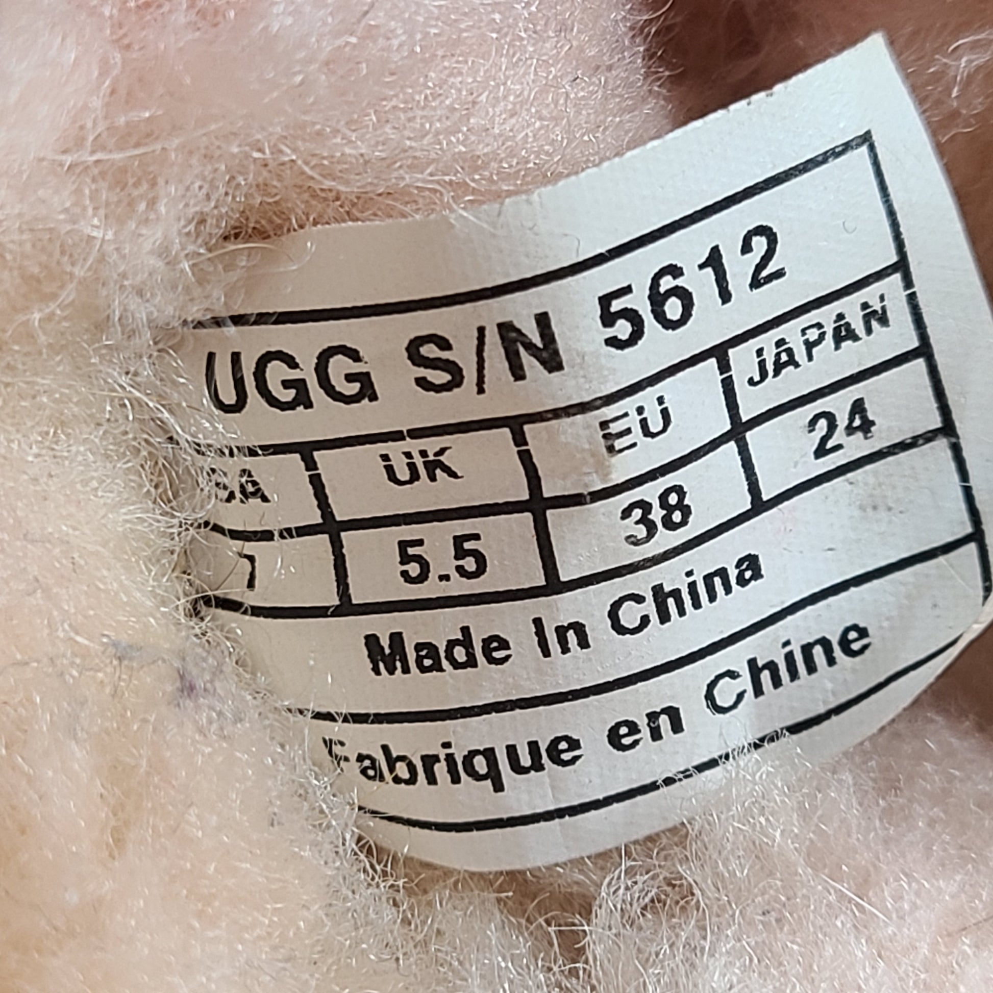 UGG Dakota moccasin slippers in pink suede for women's US 7 with soft lining and classic silhouette.