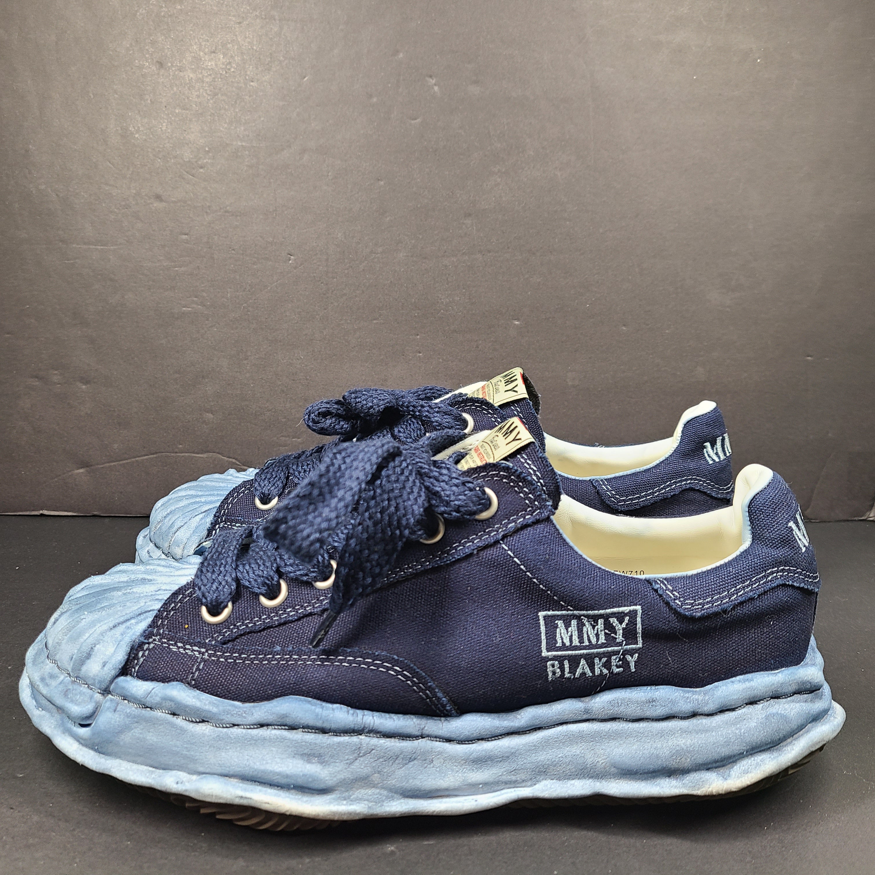 MMY Blakey low-top sneaker in blue features MMY branding on the tongue and heel and a size 44 fit.