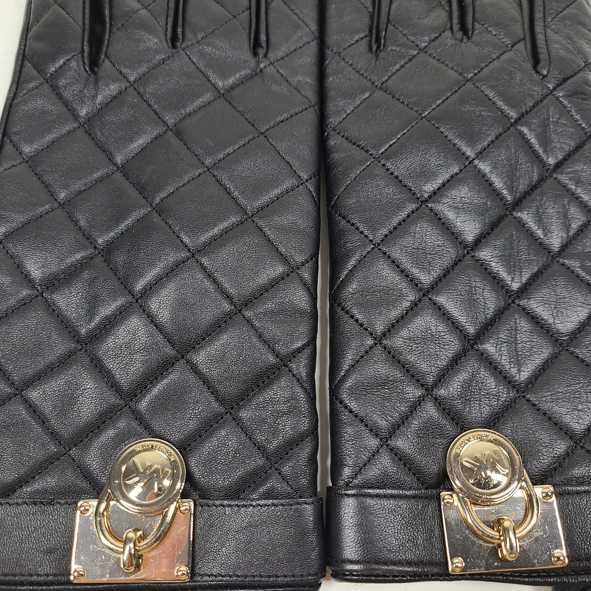 Michael Kors quilted leather gloves in black with XL sizing and refined gold-accent detail.