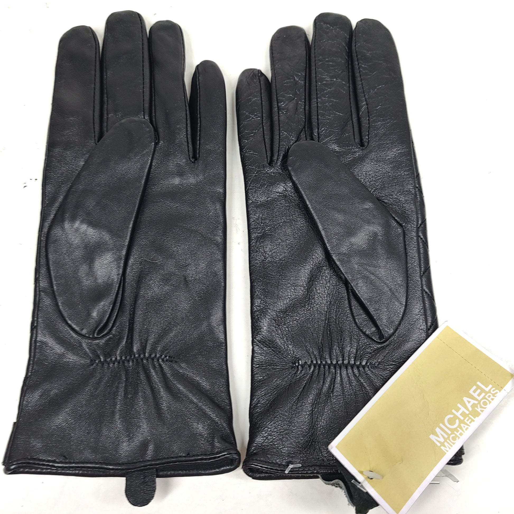 Michael Kors quilted leather gloves in black with XL sizing and refined gold-accent detail.