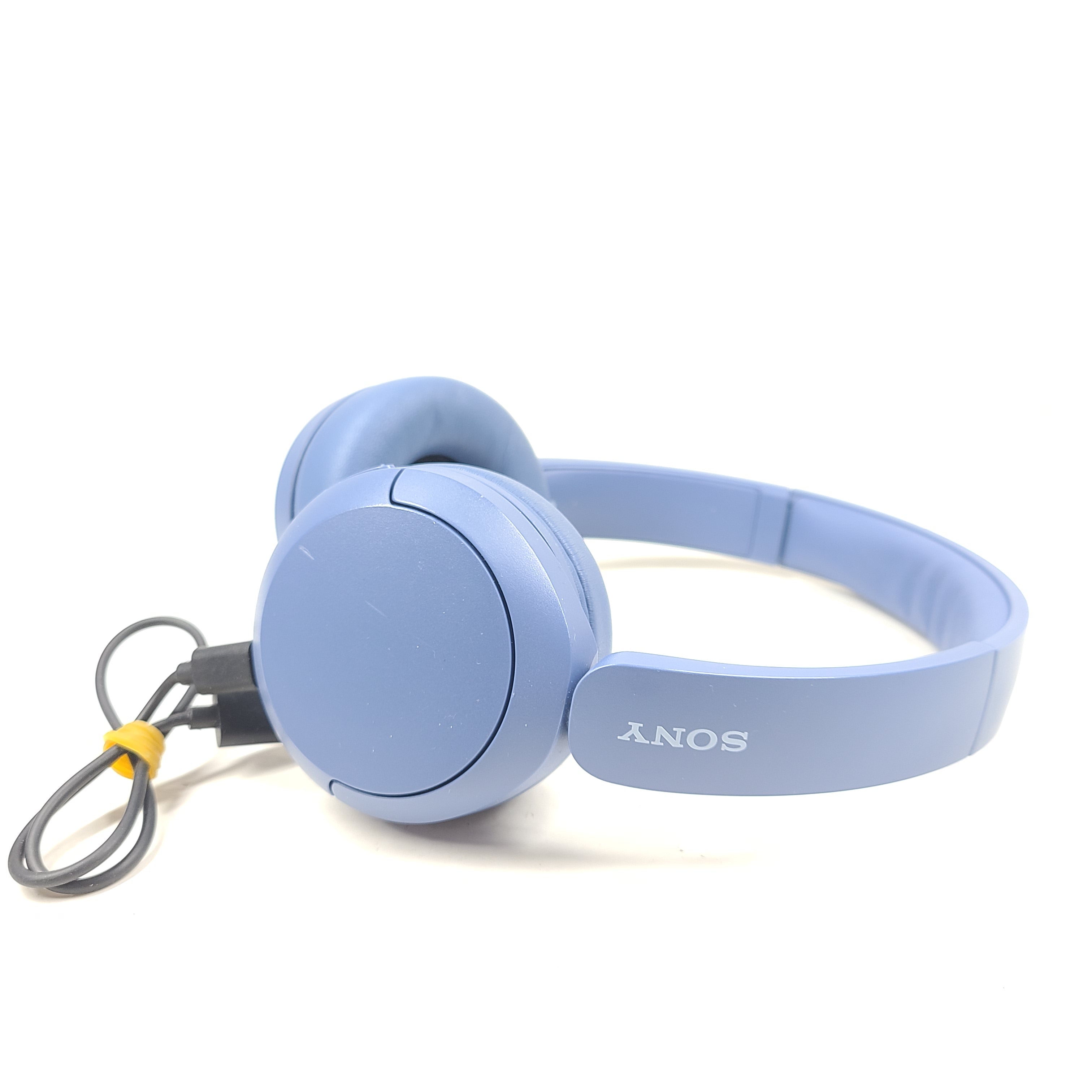 Blue Sony WH-CH520 on-ear headphones with a lightweight headband and Bluetooth connectivity for hands-free listening.